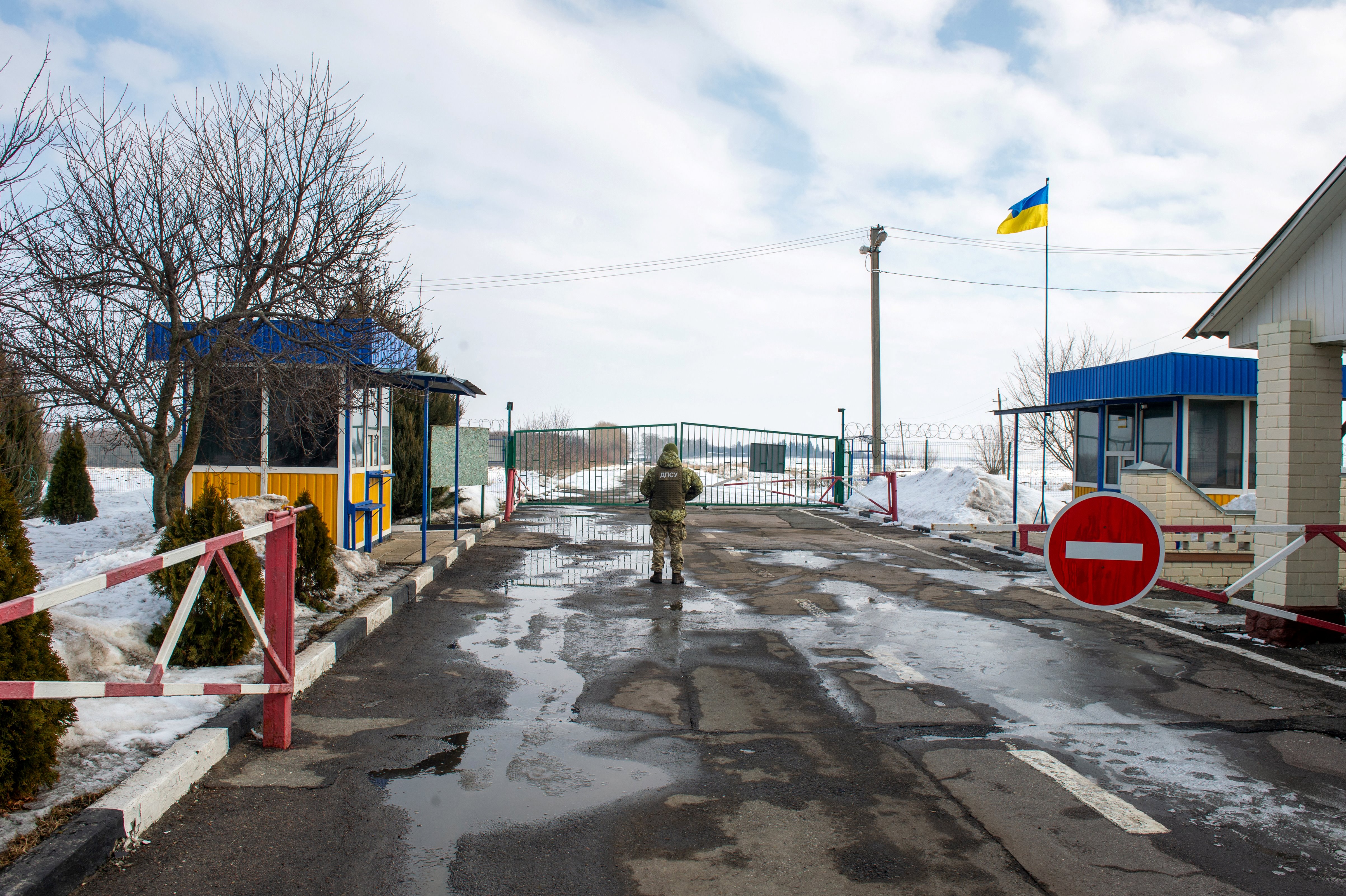 A Ukrainian frontier guard stands at the check point on the border with Russia, near the city of Kharkiv, on February 16. 