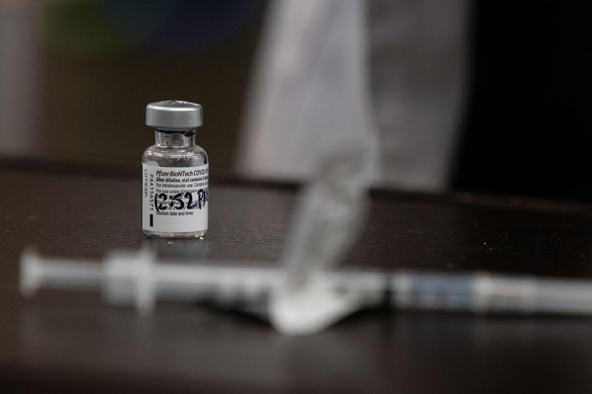 An empty vial of the Pfizer-BioNTech COVID-19 vaccine before administering residents at the Triboro Center nursing home in the Bronx borough of New York on December 21.