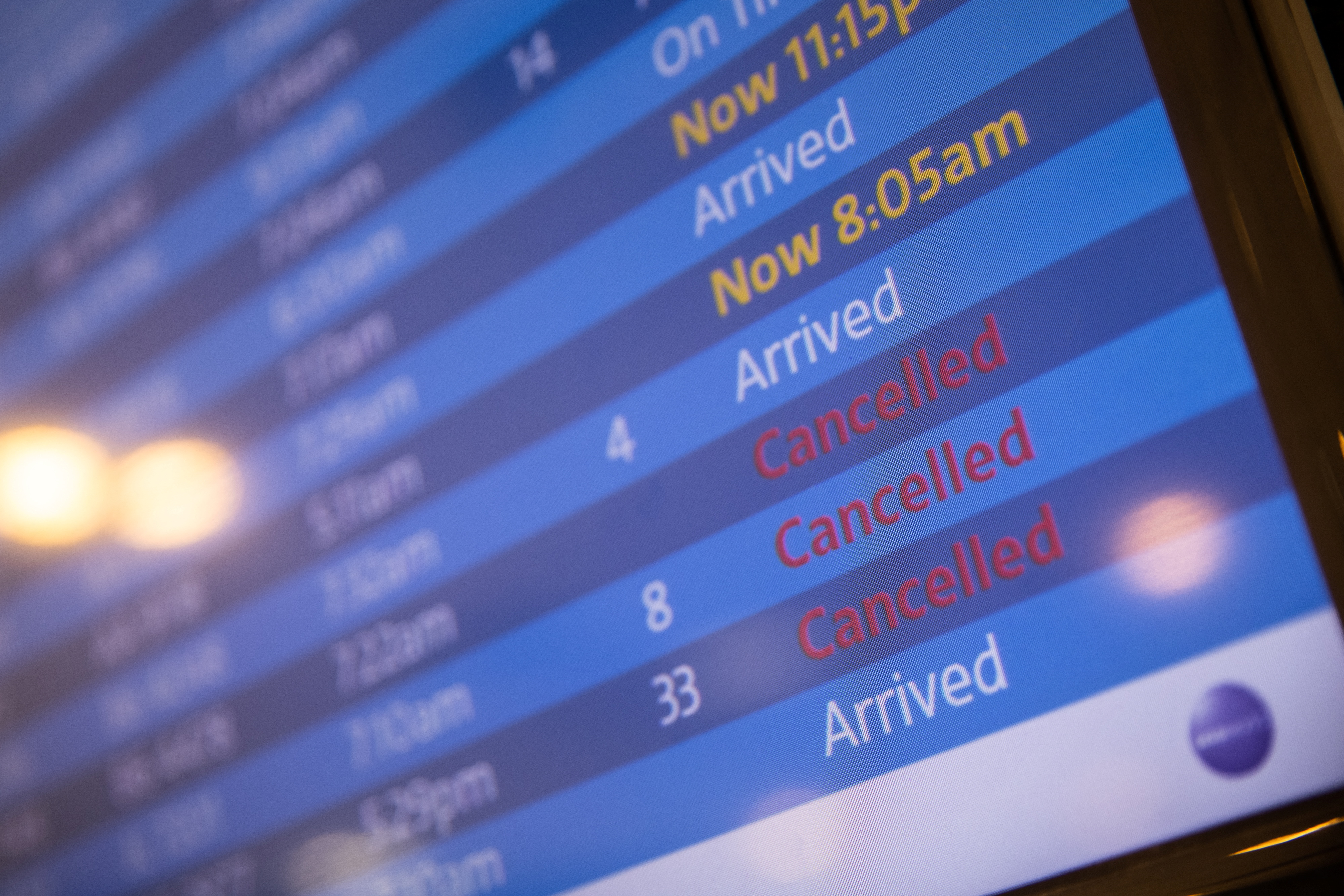 A screen showing cancelled flights is seen at John F. Kennedy International Airport during the spread of the Omicron coronavirus variant in Queens, New York City, U.S., December 26, 2021. 