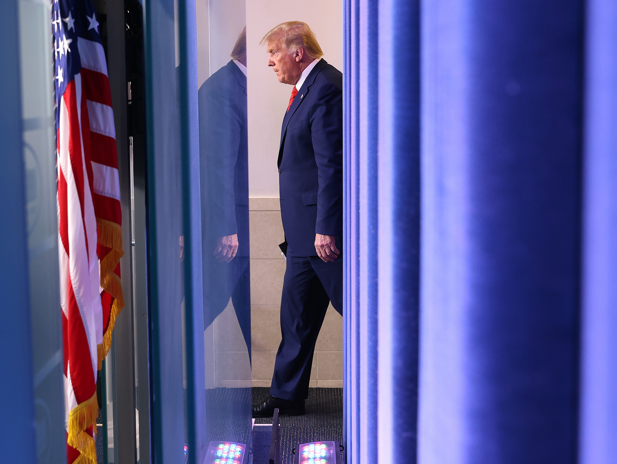President Donald Trump walks into the briefing room to speak at the White House on August 31 in Washington.