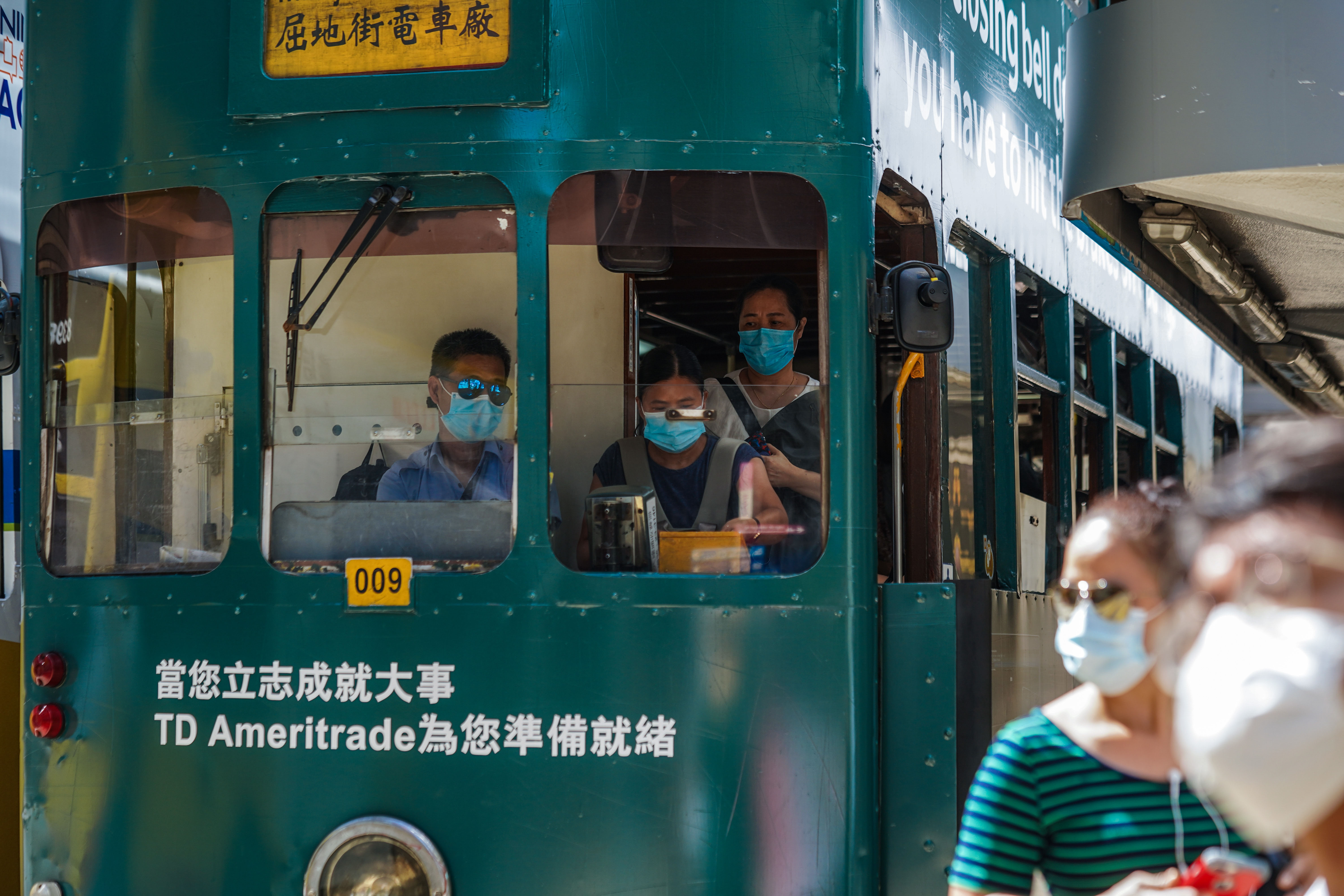 People get off a tram in Hong Kong on July 15.