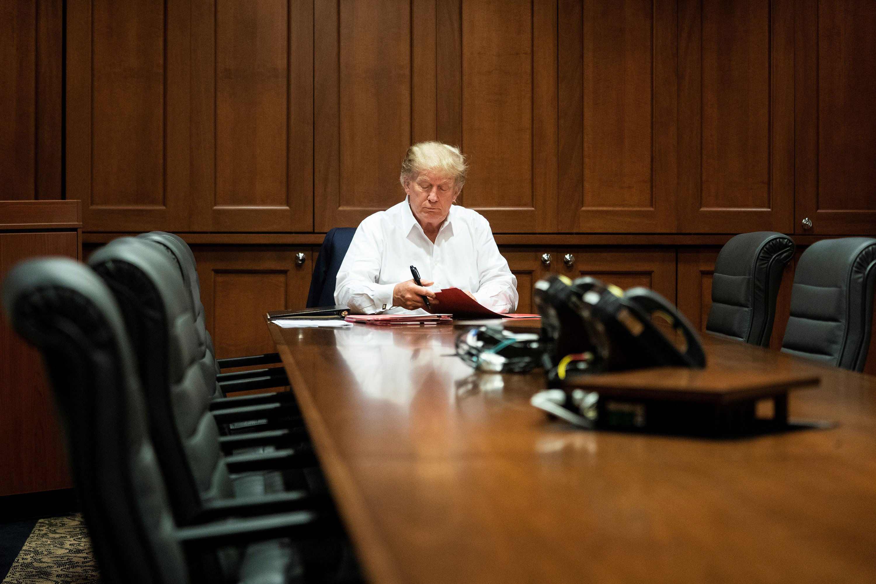 President Donald Trump works in the Presidential Suite at the Walter Reed National Military Medical Center in Bethesda, Maryland on Saturday, October 3.
