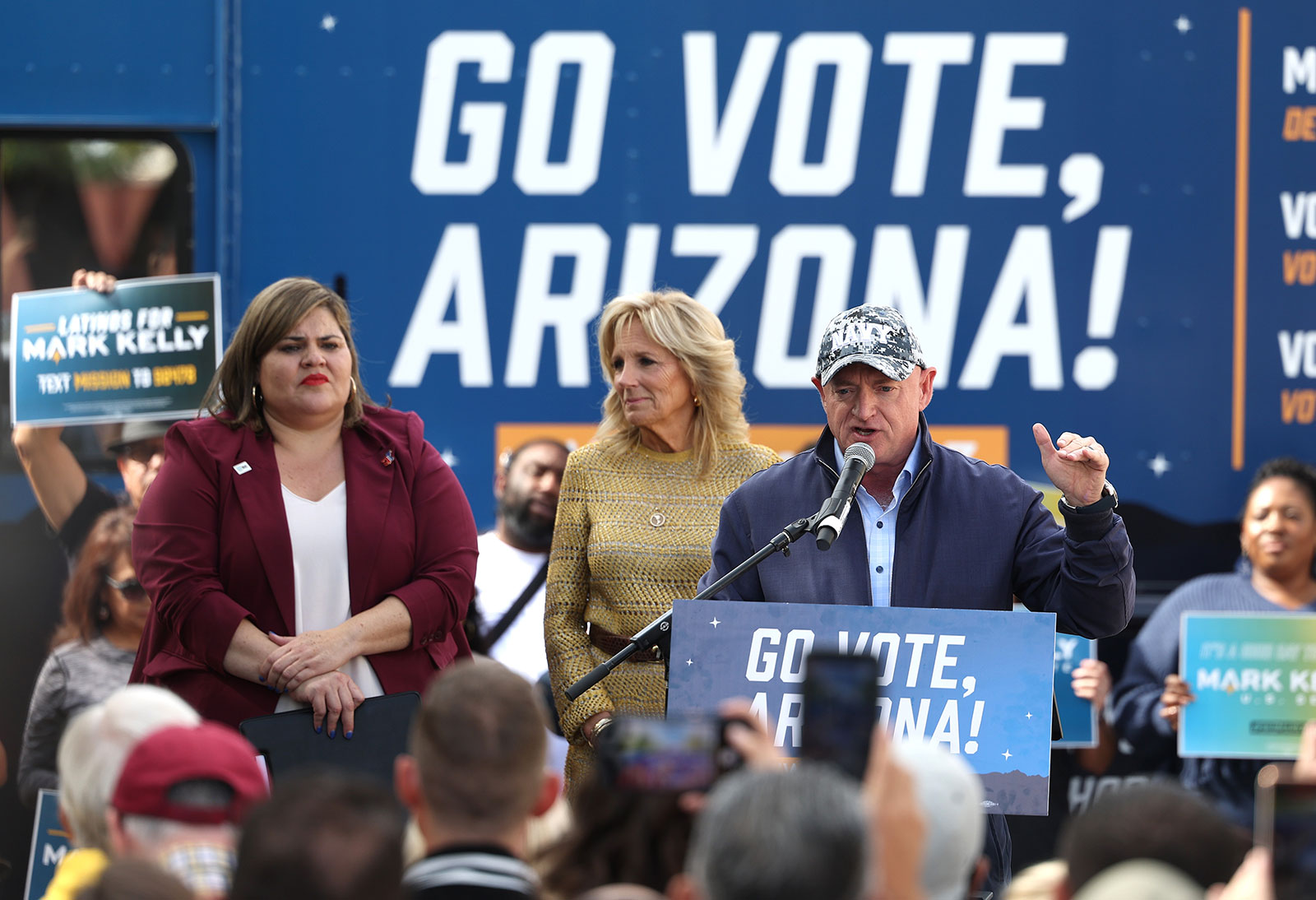 Sen. Mark Kelly speaks alongside First Lady Jill Biden and Arizona democratic chair Raquel Terán during a campaign event on November 5. 