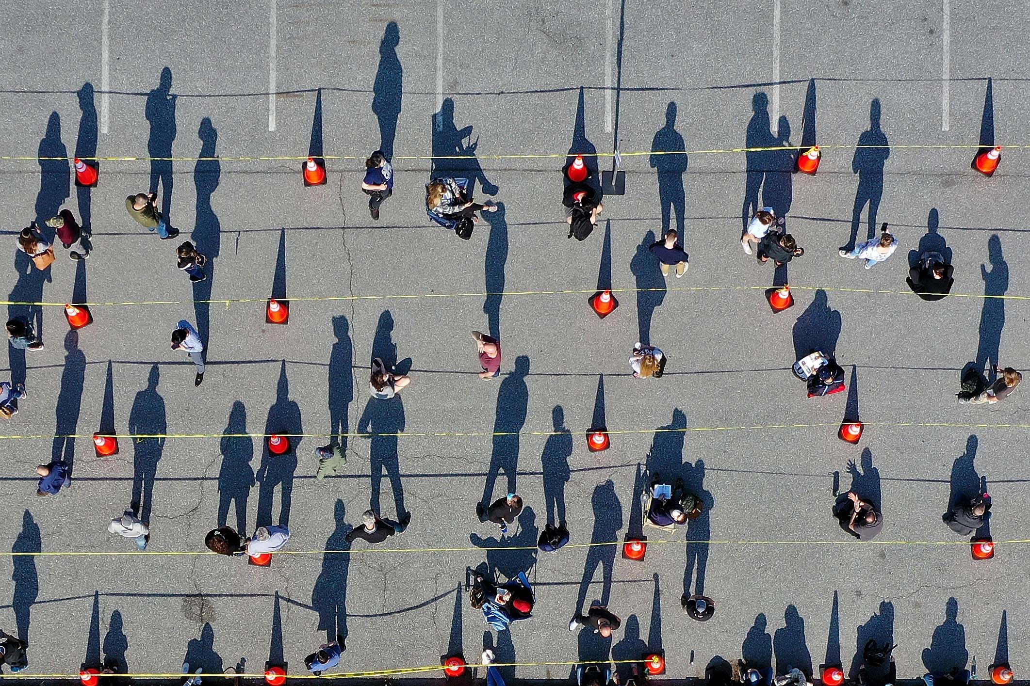 People stand in line outside a coronavirus mass vaccination site in Hagerstown, Maryland, on April 7.