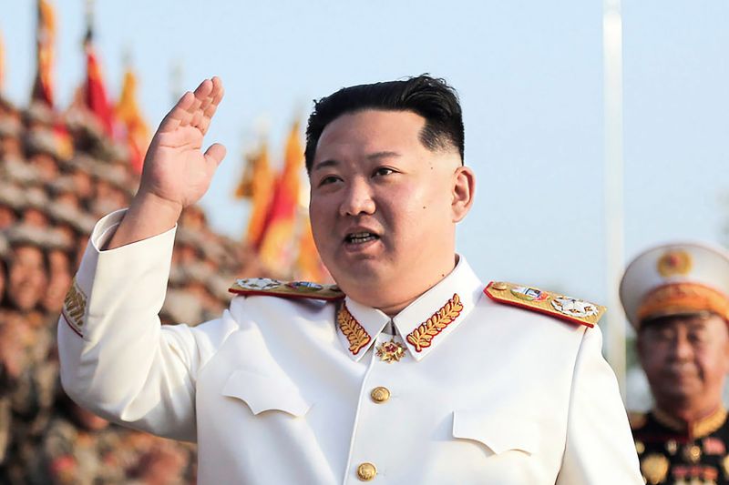 North Korean leader Kim Jong Un waves to officers and soldiers in a celebration of the 90th founding anniversary of the Korean People's Revolutionary Army, in North Korea on April 27.