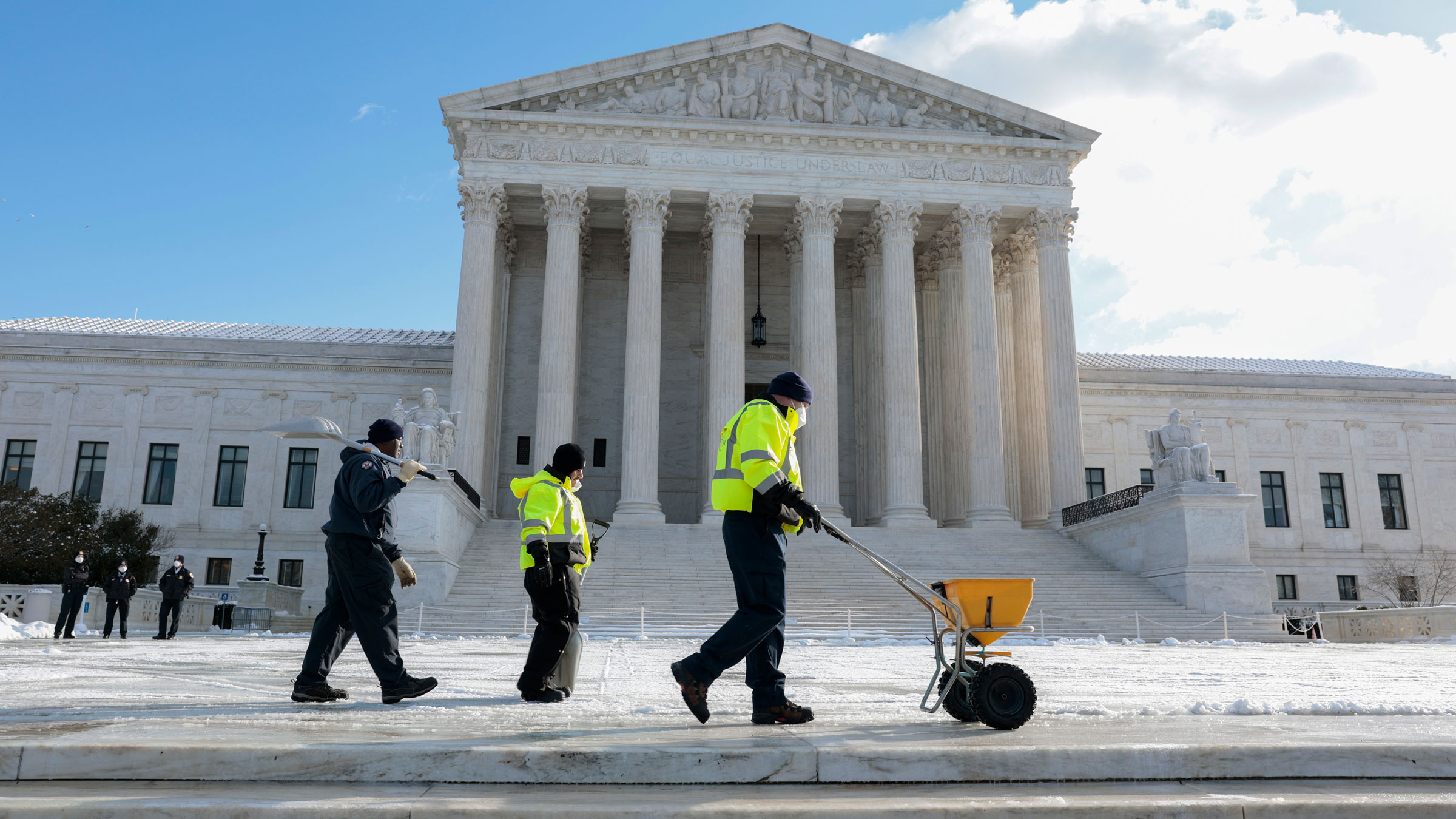 People pour salt on the front plaza of the US Supreme Court on Friday.