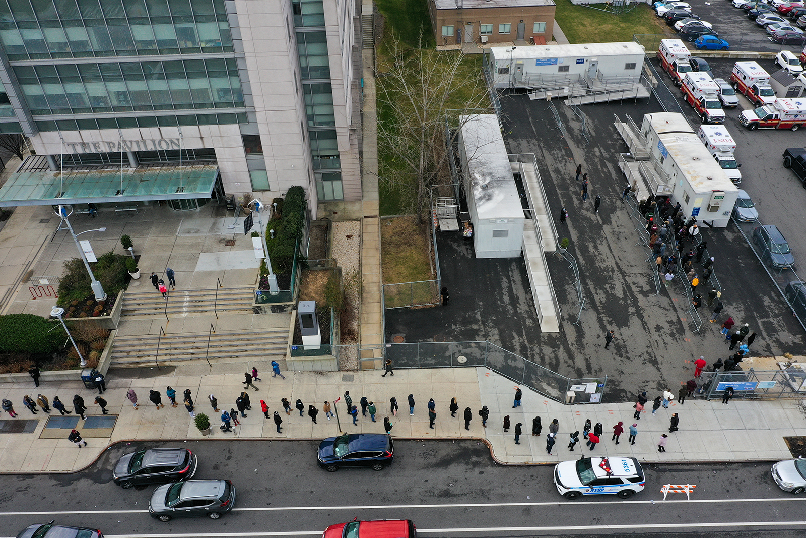 An aerial view of a long line is seen at a Covid-19 testing center next to the Queens Hospital Center as hundreds of residents to get Covid-19 test in Queens, New York, on December 28.