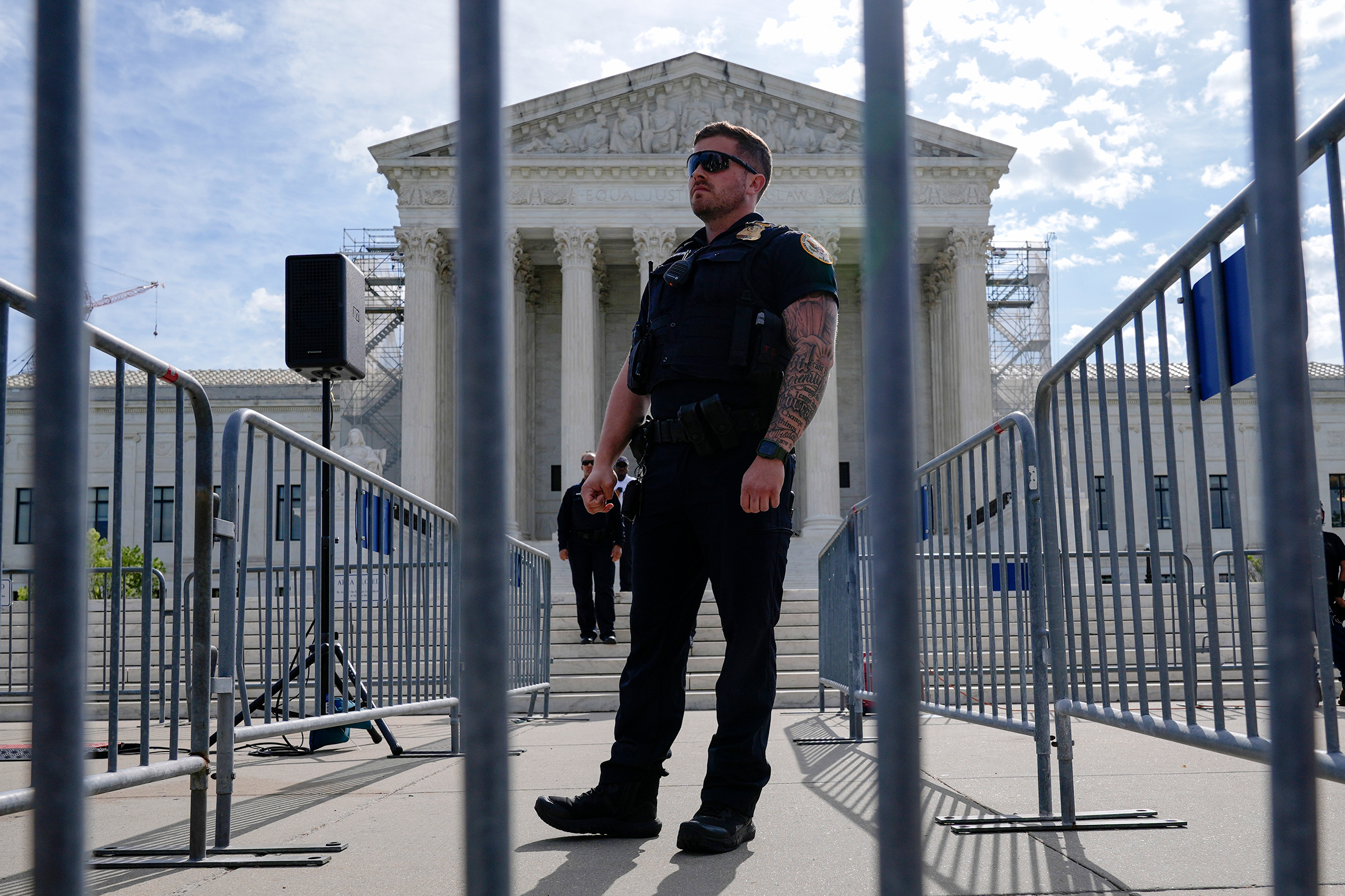 The US Capitol Police officer stands guard in front of the US Supreme Court on Wednessday.