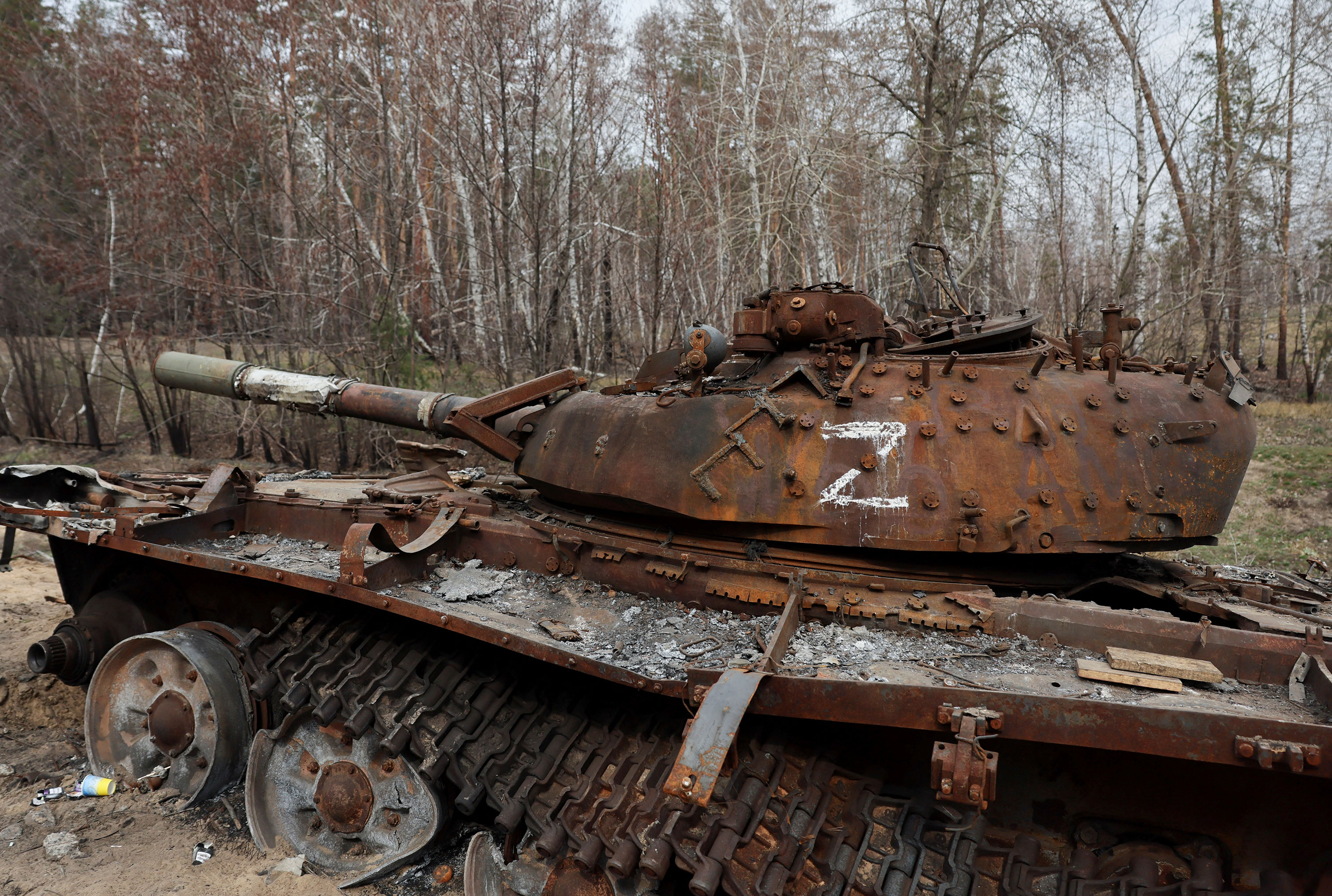 A destroyed Russian tank sits on the side of the road near Kreminna, Ukraine, on March 24.