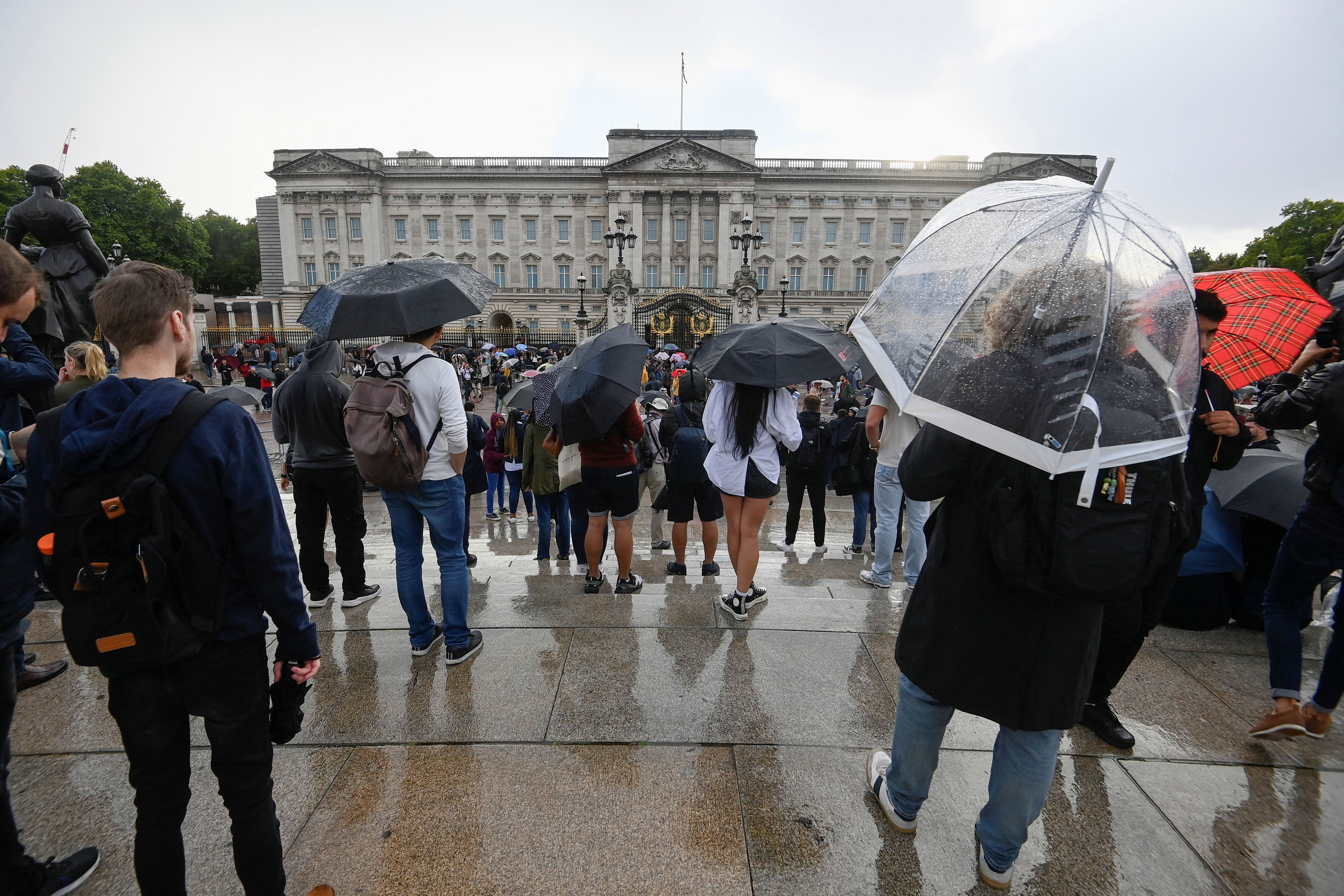People gather outside Buckingham Palace on Thursday.