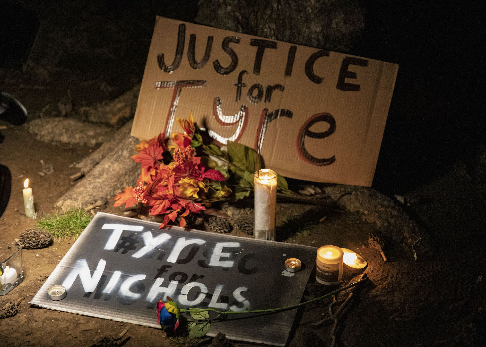Signs and candles are seen at Tobey Skatepark.