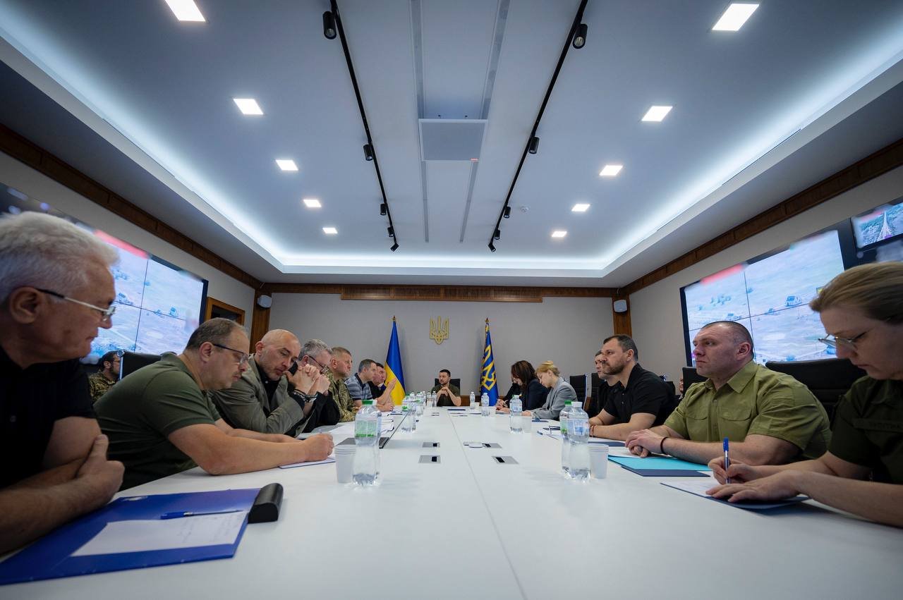 Ukrainian President Volodymyr Zelensky, center right, chairs an emergency meeting after the dam breach in Russian-occupied Kherson, Ukraine, on June 6.