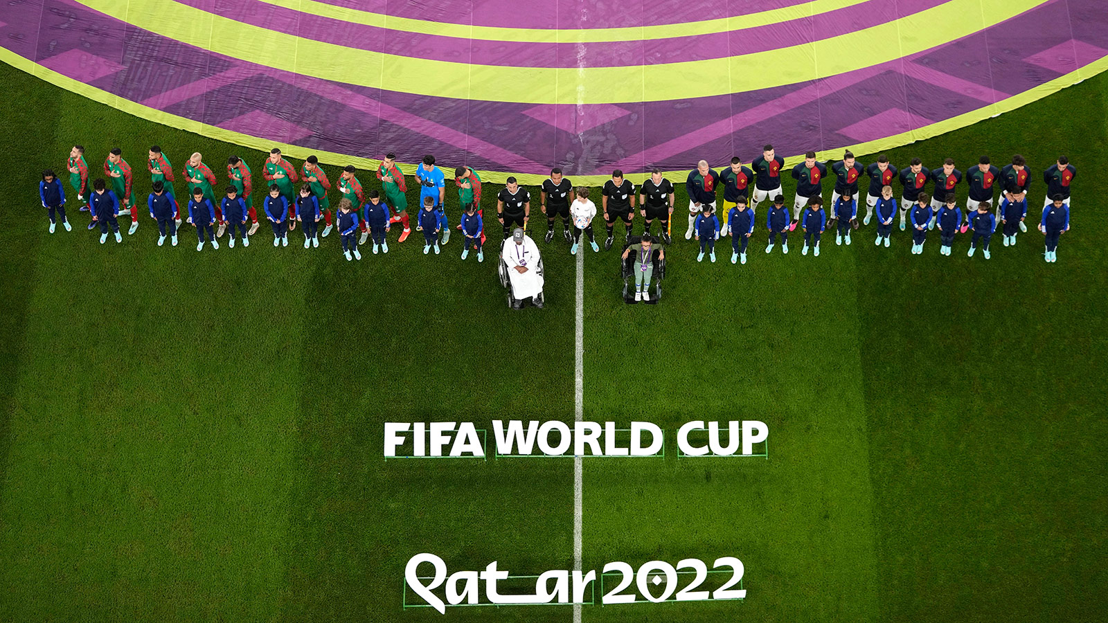 The Morocco and Portugal players line up before the start of their match on Saturday. 