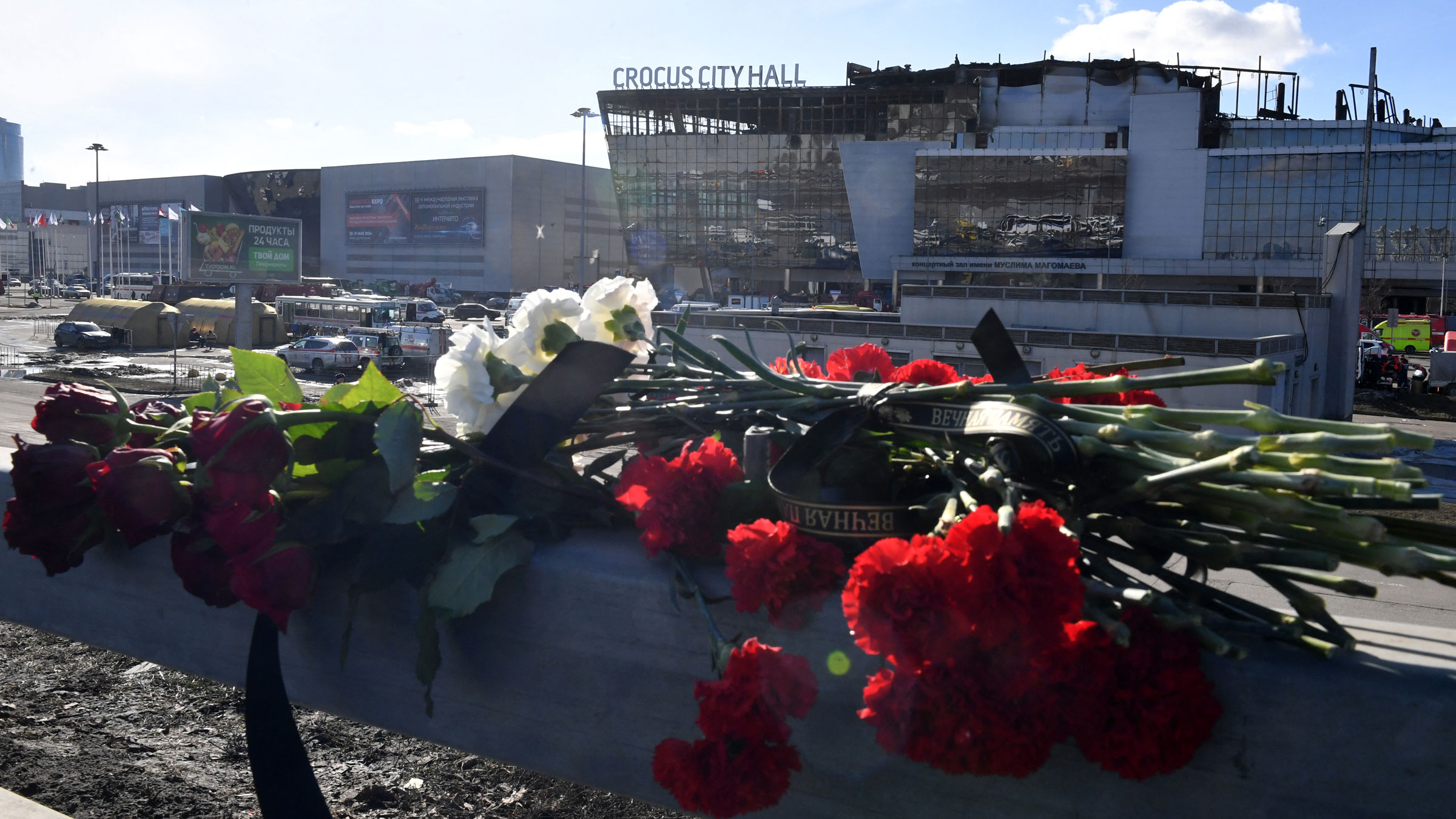 Flowers are left near the Crocus City concert hall on Monday.