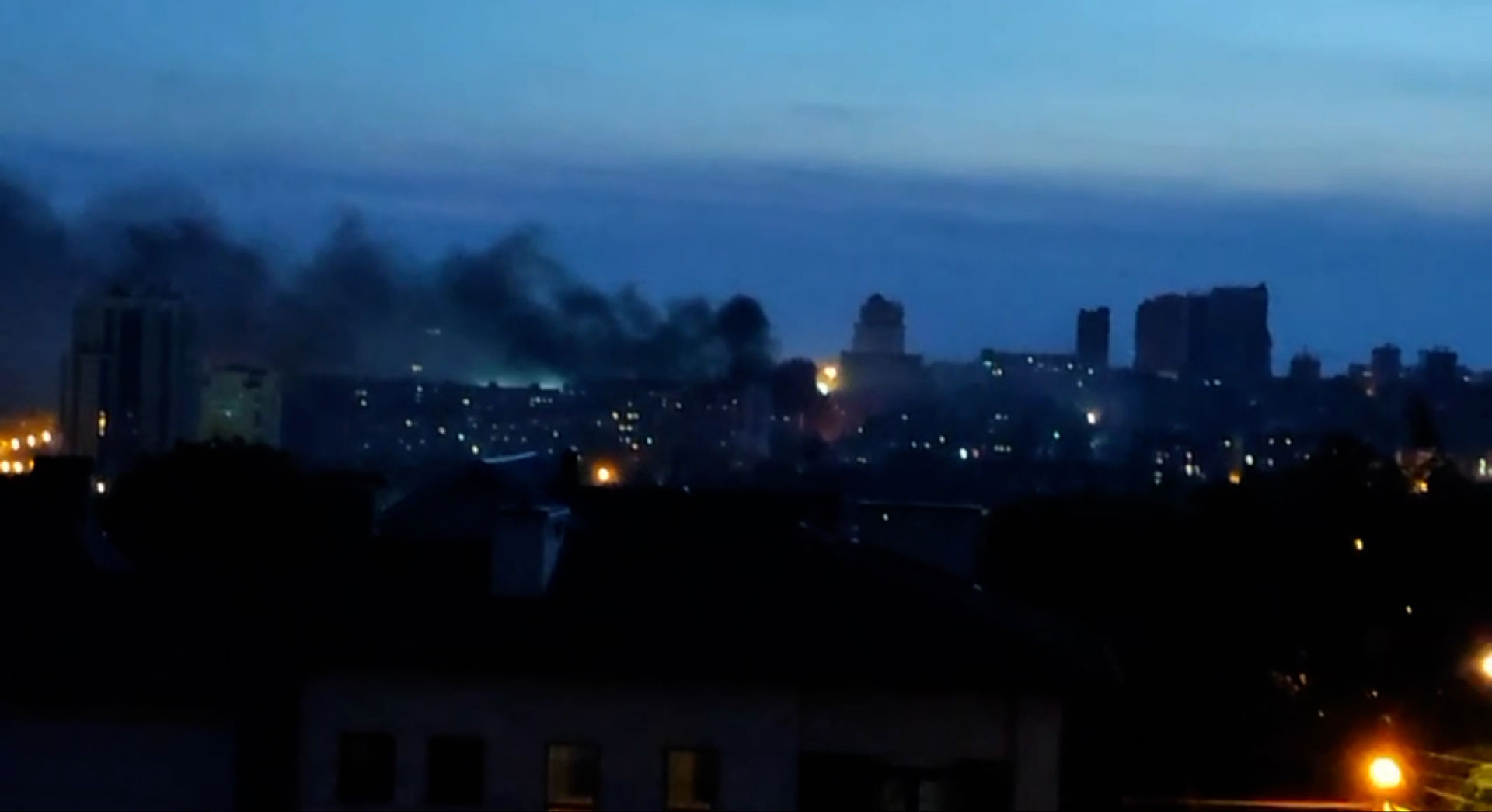 The city of Donetsk at dusk after explosions, on Saturday.