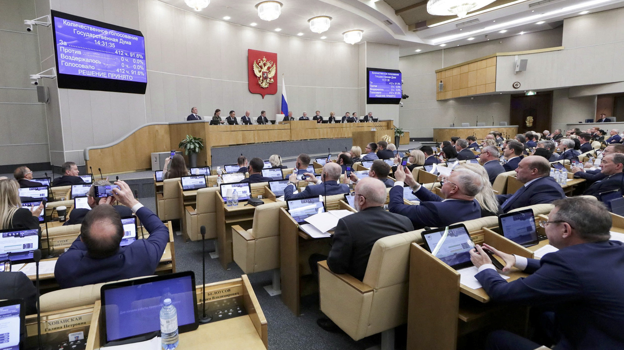 Members of the Russian State Duma, the lower house of parliament, attend a session to approve laws on annexing Ukraine's Donetsk, Kherson, Luhansk and Zaporizhzhia regions into Russia, in Moscow, Russia, on October 3.