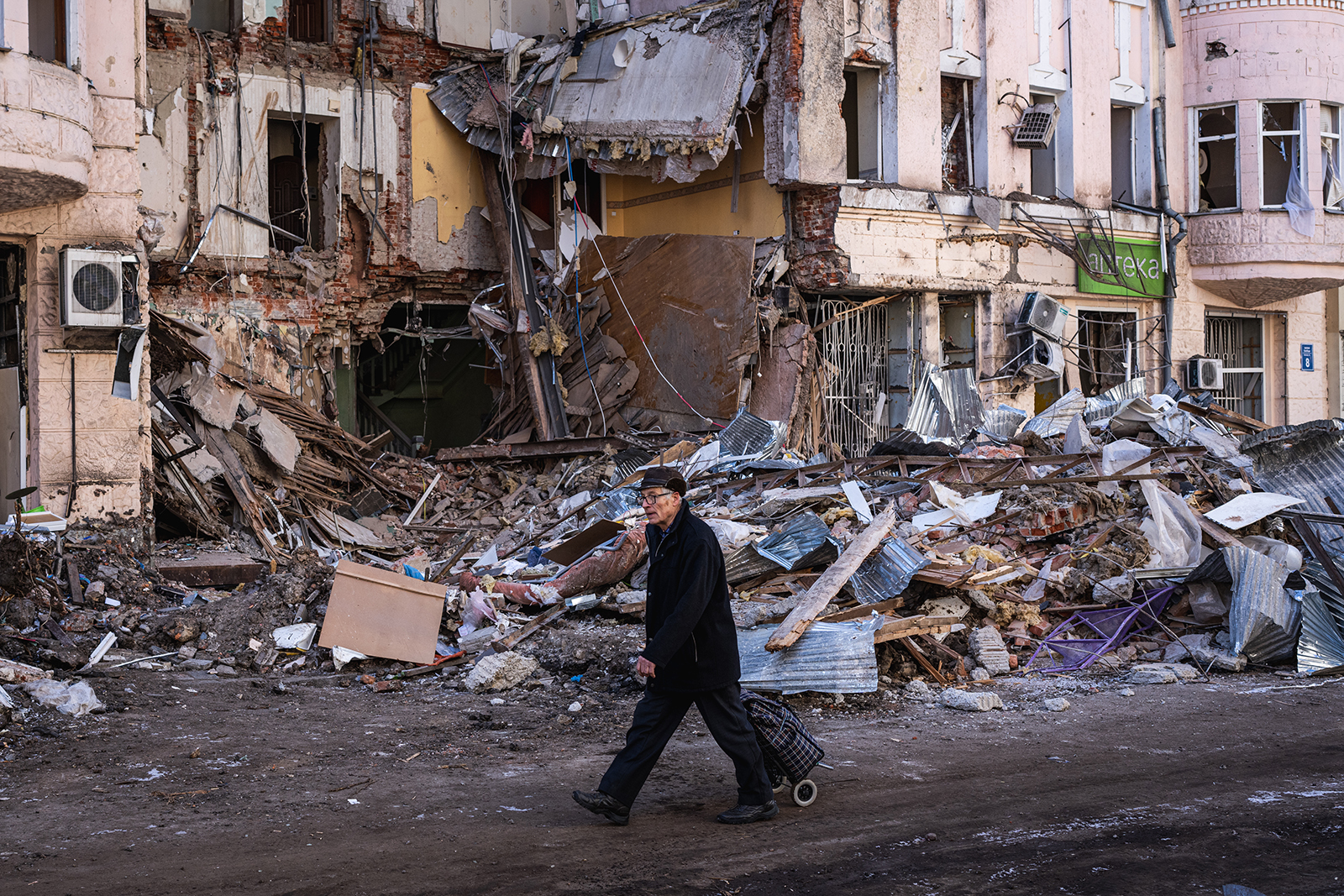 A man walks amongst the damaged in buildings in Kharkiv, Ukraine, on March 19.