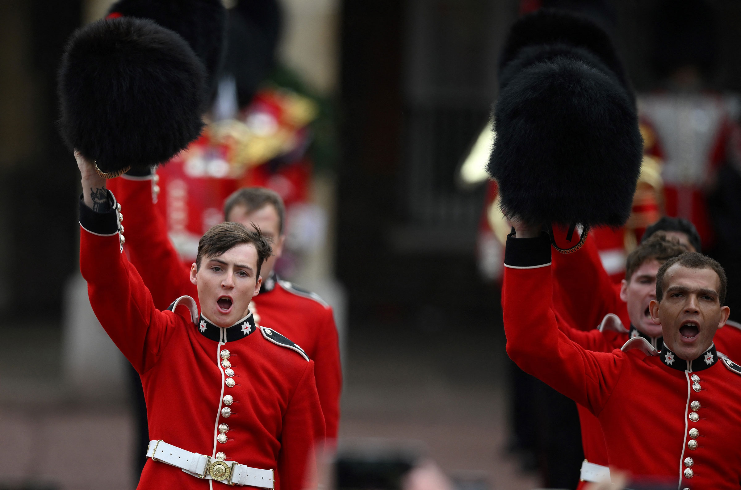 Members of the Coldstream Guards raise their hats as they salute the new King following his proclamation at St. James's Palace.