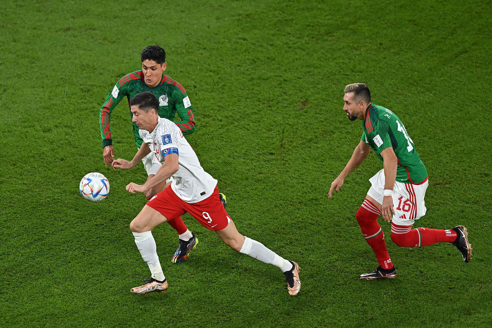 Poland's forward Robert Lewandowski drives the ball during the match against Mexico on November 22.