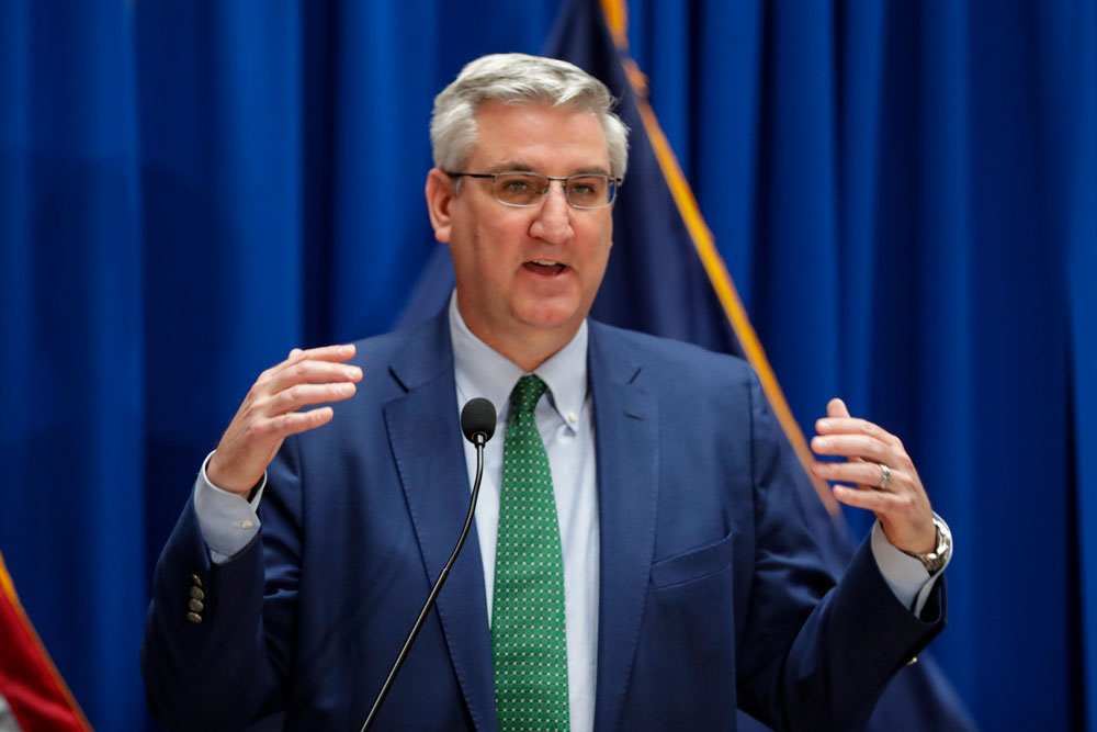 In this March 24 file photo, Indiana Gov. Eric Holcomb answers questions at the Statehouse in Indianapolis. 