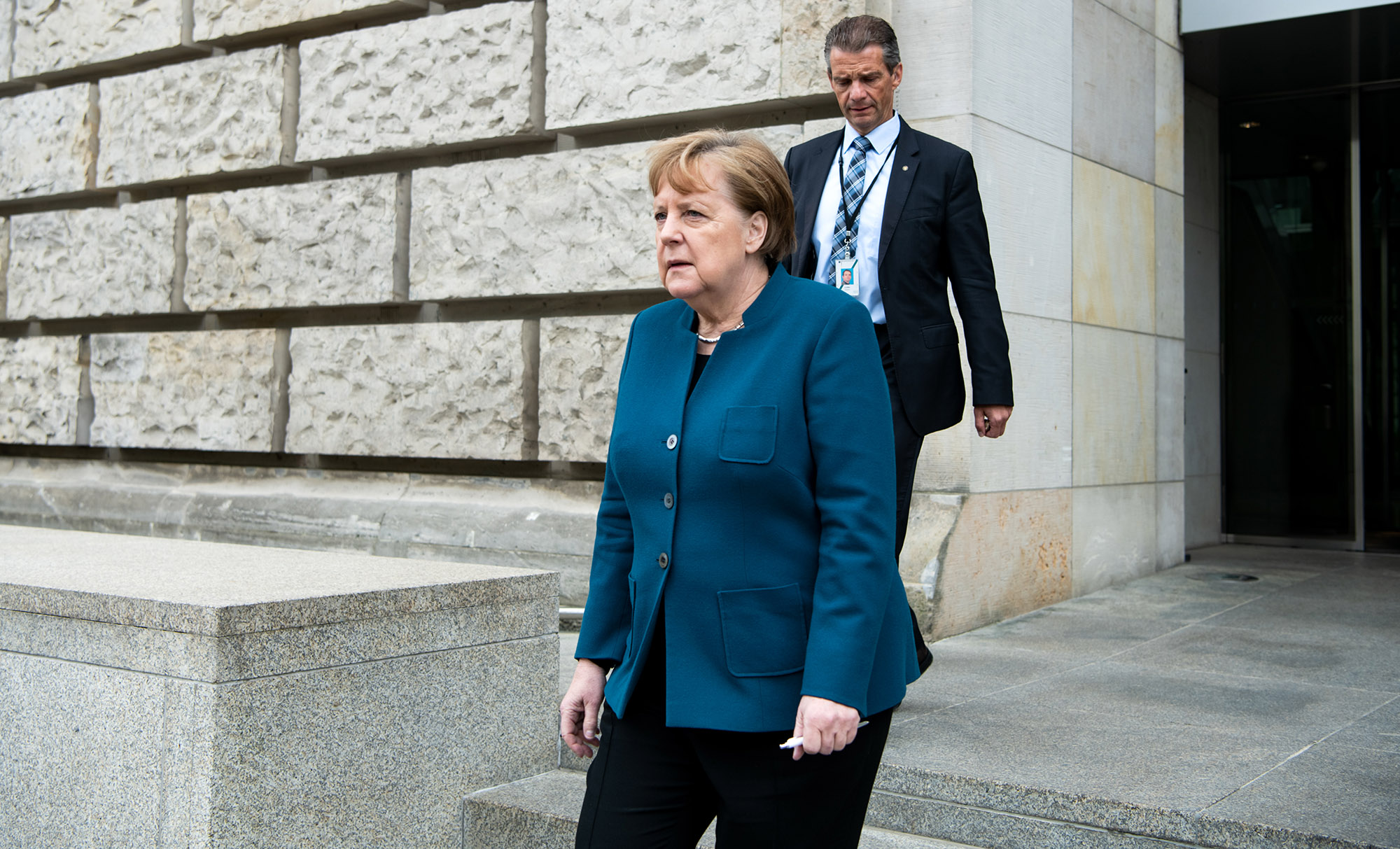 Germany Chancellor Angela Merkel leaves the Bundestag during the plenary session in Berlin on May 7.  