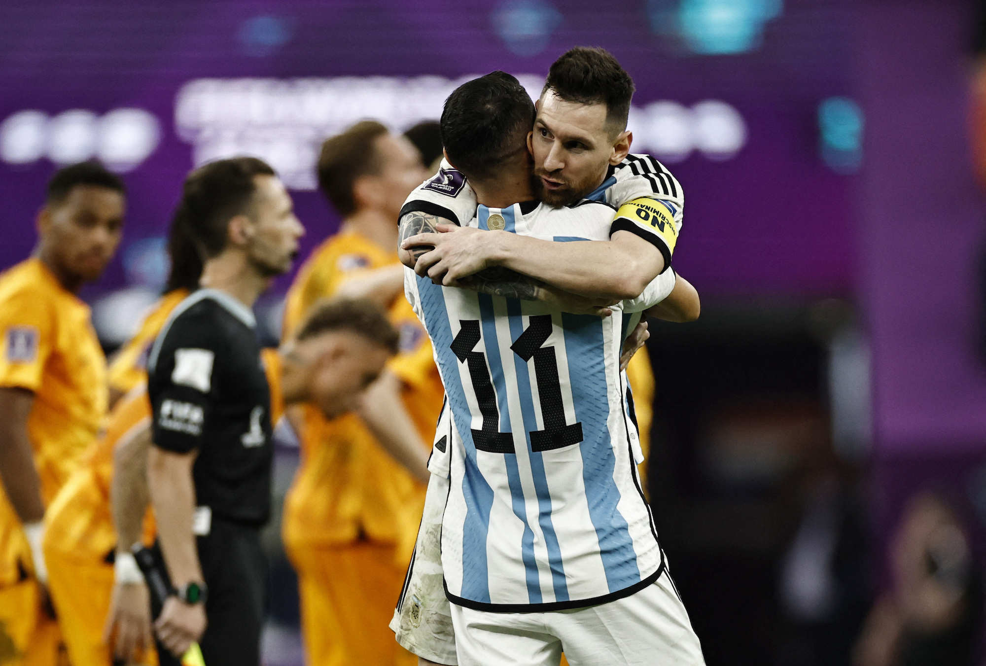 Lionel Messi and Angel Di Maria celebrate after a win against the Netherlands.