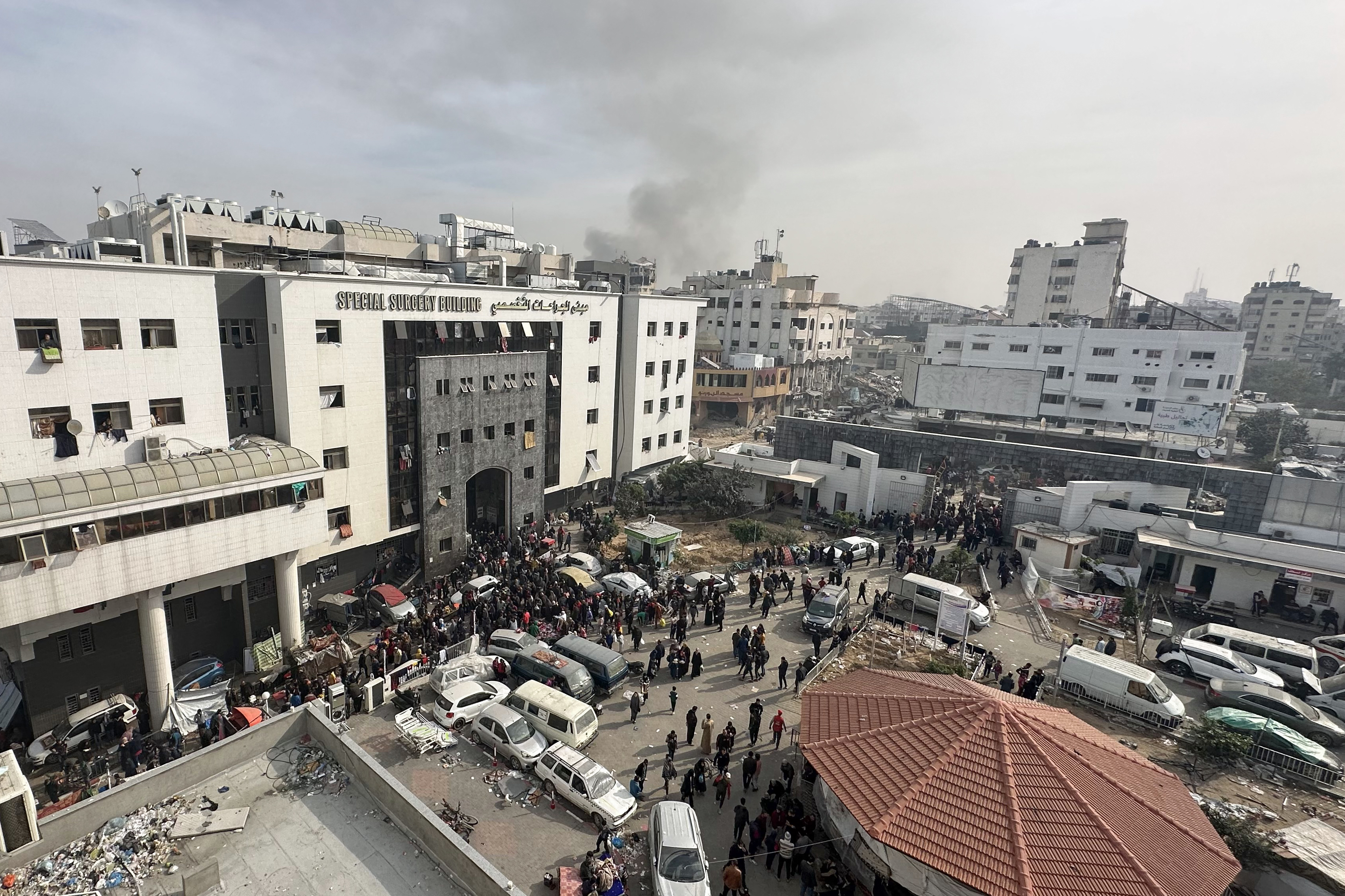 Displaced Palestinians gather in the yard of Al-Shifa Hospital in Gaza on December 10.