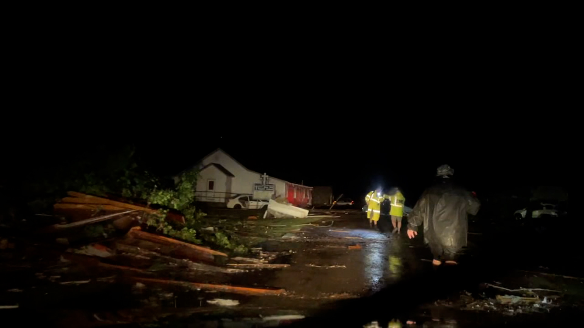 Emergency responders work amid storm damage in Barnsdall, Oklahoma.