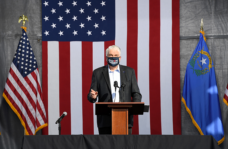 Nevada Gov. Steve Sisolak speaks during a voter mobilization drive-in event at UNLV on October 2, 2020 in Las Vegas, Nevada. 