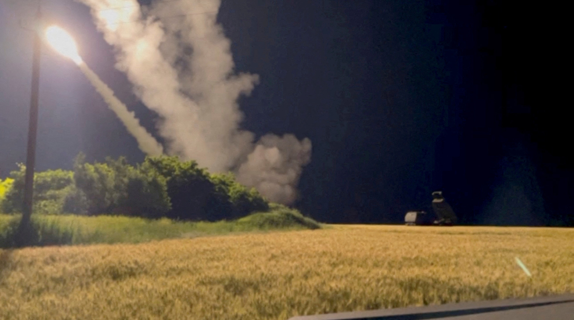 A High Mobility Artillery Rocket System (HIMARS) is fired in an undisclosed location in Ukraine in this still image from June 24.