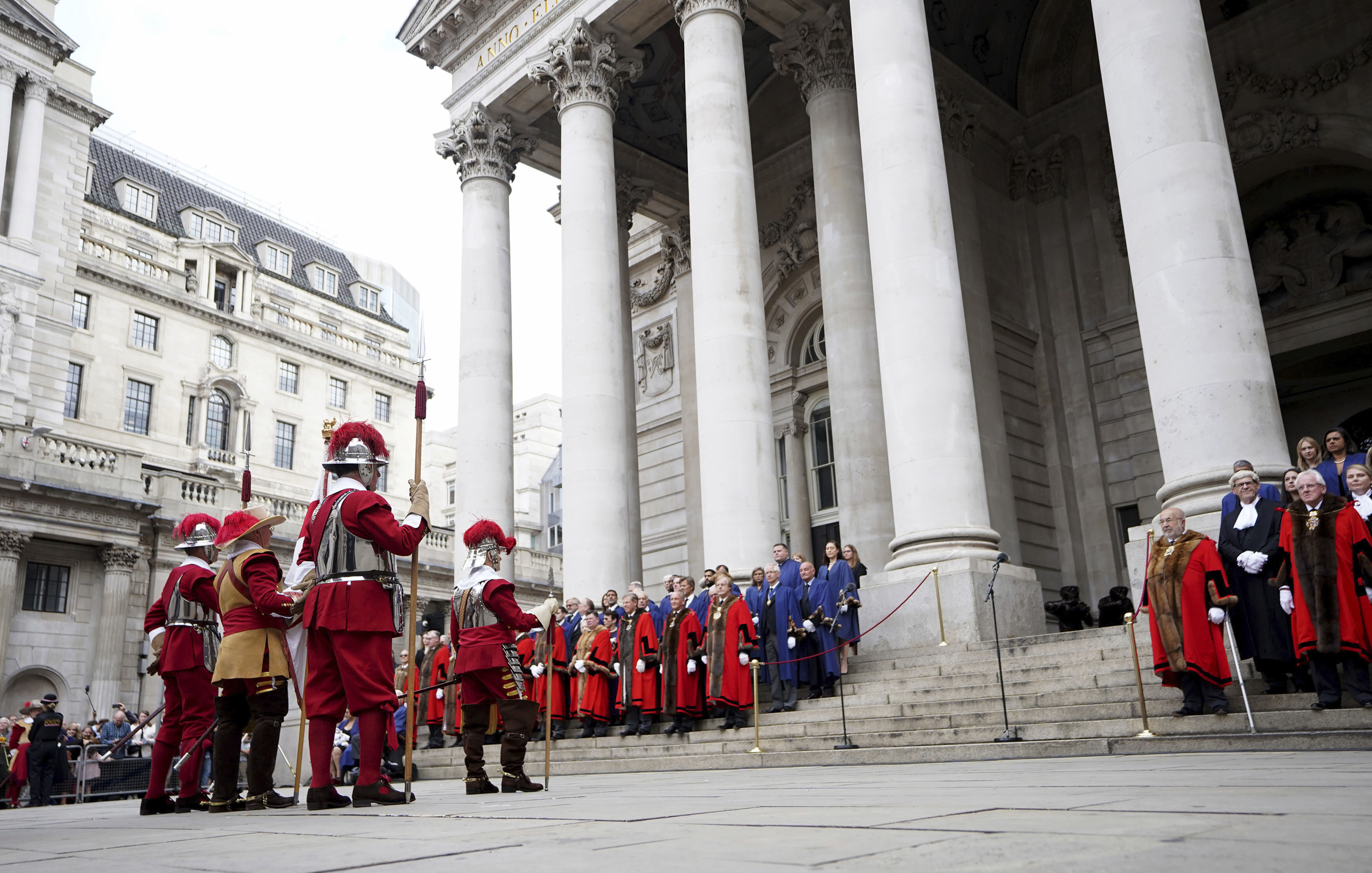 Pikemen of the Honourable Artillery Company, left, stand outside the Royal Exchange in the City of London, Saturday, September 10, before the reading of the Proclamation of Accession of King Charles III.