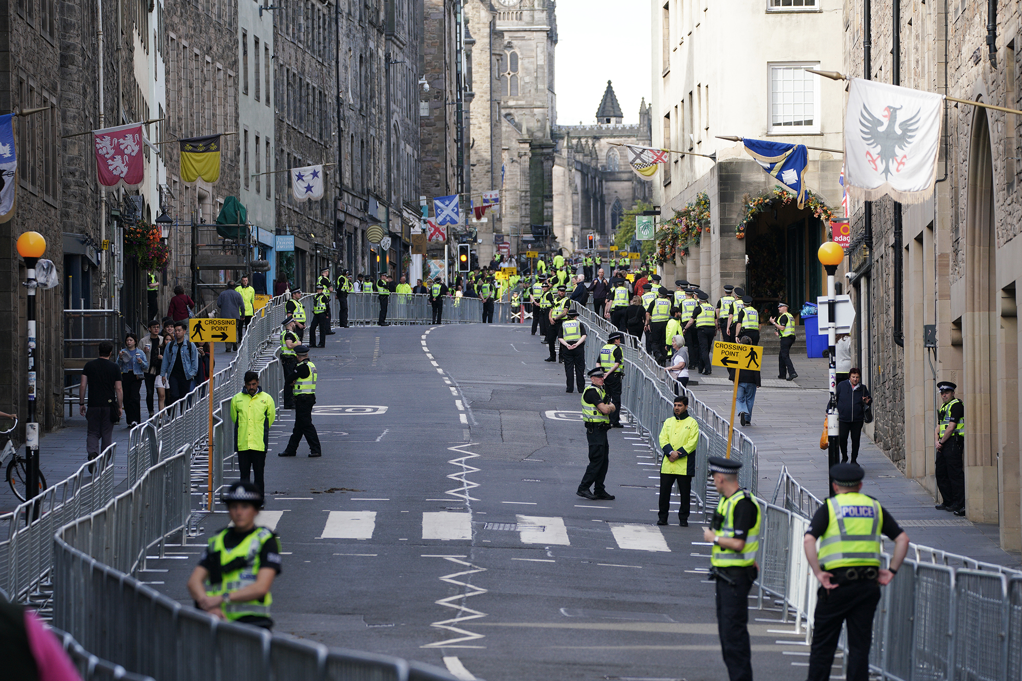 Police officers patrol along Royal Mile in Edinburgh, Scotland, as preparations are made for the arrival of the coffin of Queen Elizabeth II, on September 11. 