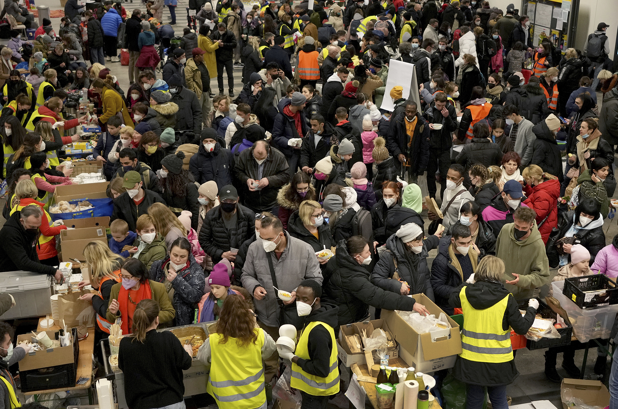 Ukrainian refugees queue for food in the welcome area after their arrival at the main train station in Berlin, Germany, on March 8.