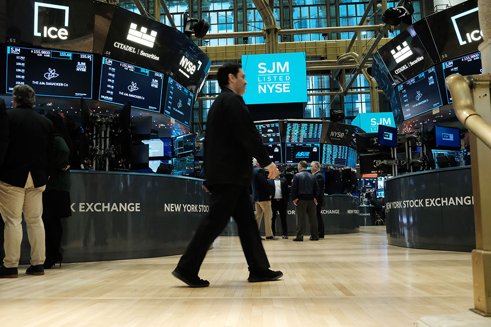 Traders work on the floor of the New York Stock Exchange on Tuesday, December 13, in New York City. 
