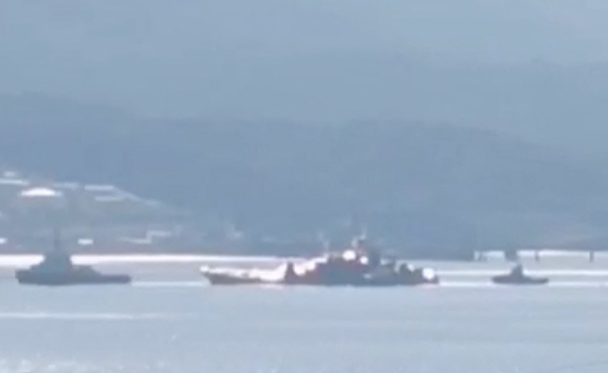 A Russian Navy landing ship is tugged to shore in Novorossiysk, Russia, on August 4, in this screengrab taken from a handout video. 