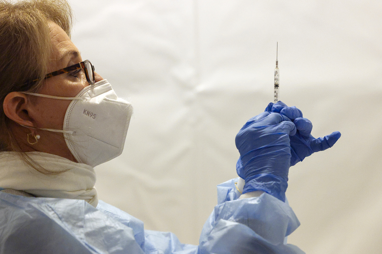 A healthcare worker prepares a dose of the Pfizer BioNTech Covid-19 vaccine at a vaccination site in the Bronx borough of New York, on February 5.