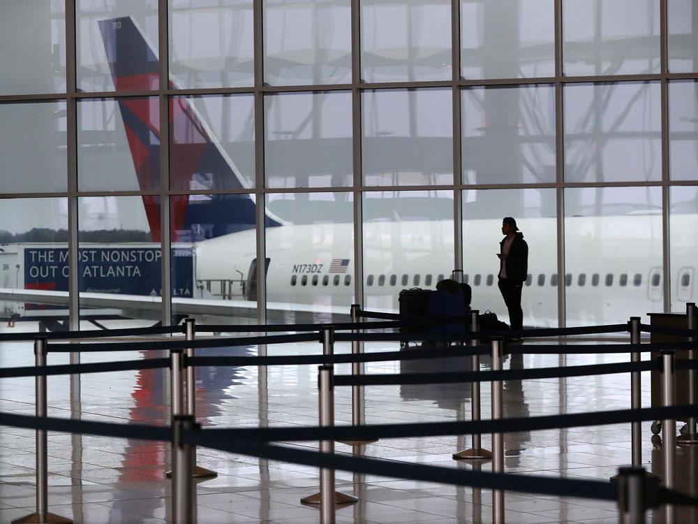 A Delta airplane sits at the International Terminal at Hartsfield-Jackson International Airport in Atlanta on Monday, March 16.