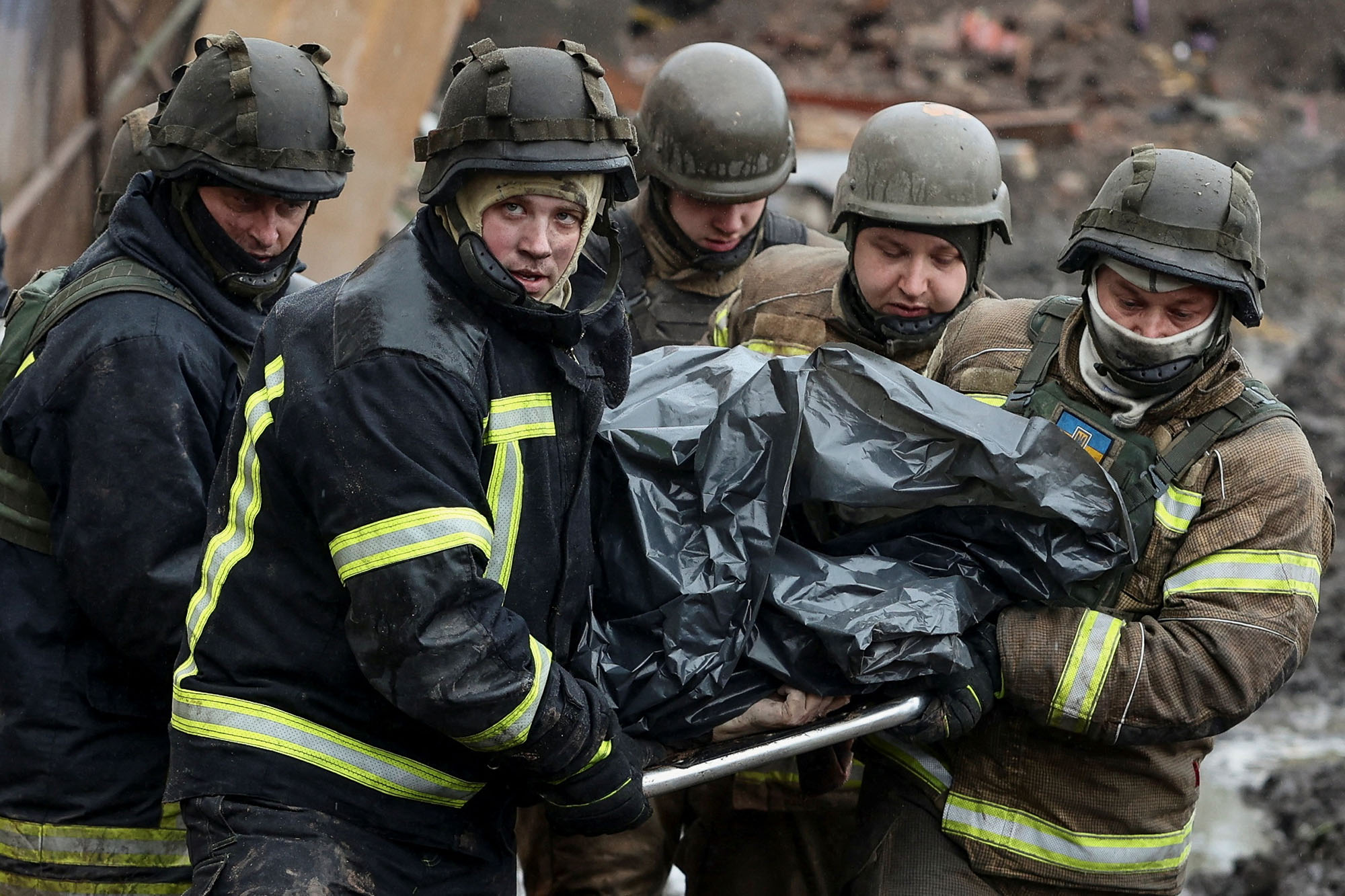 Rescuers remove a body from the site of a Russian missile attack in Kupyansk, Kharkiv region, Ukraine, on April 25.