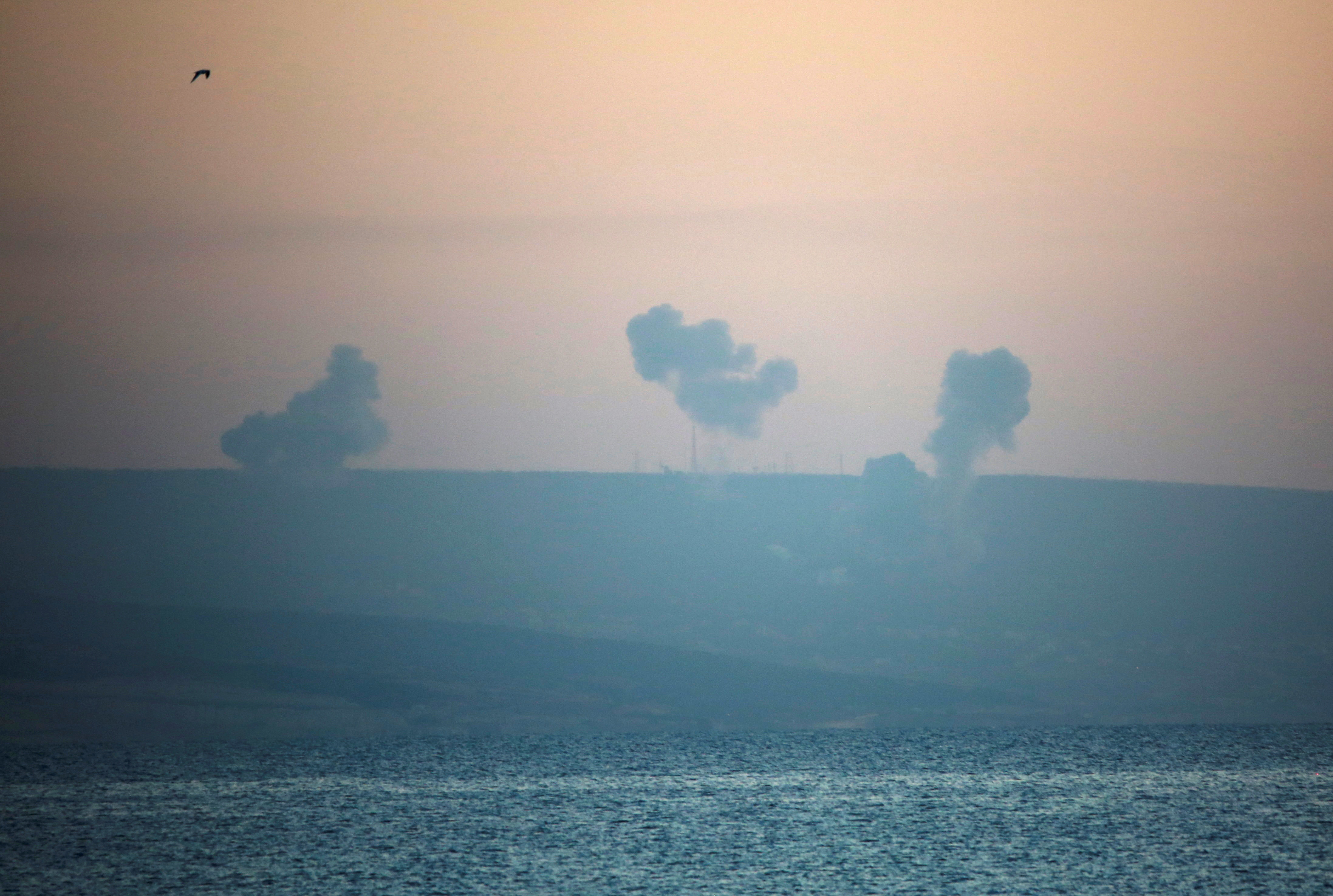 Smoke rises on the Lebanese side of the border with Israel, as seen from Tyre, Lebanon, on Saturday, December 2.