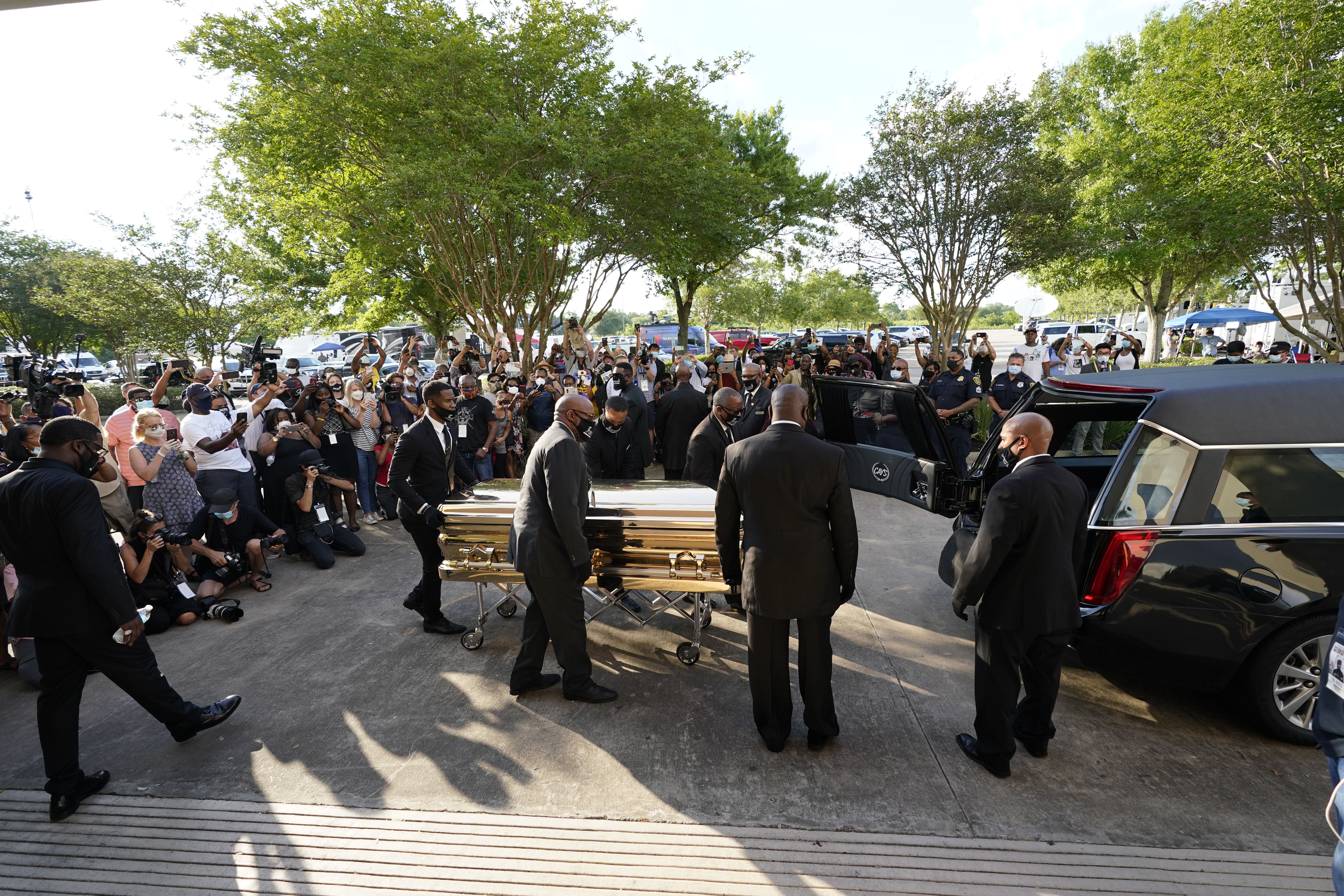 The casket of George Floyd is removed after a public visitation at the Fountain of Praise church in Houston on June 8.