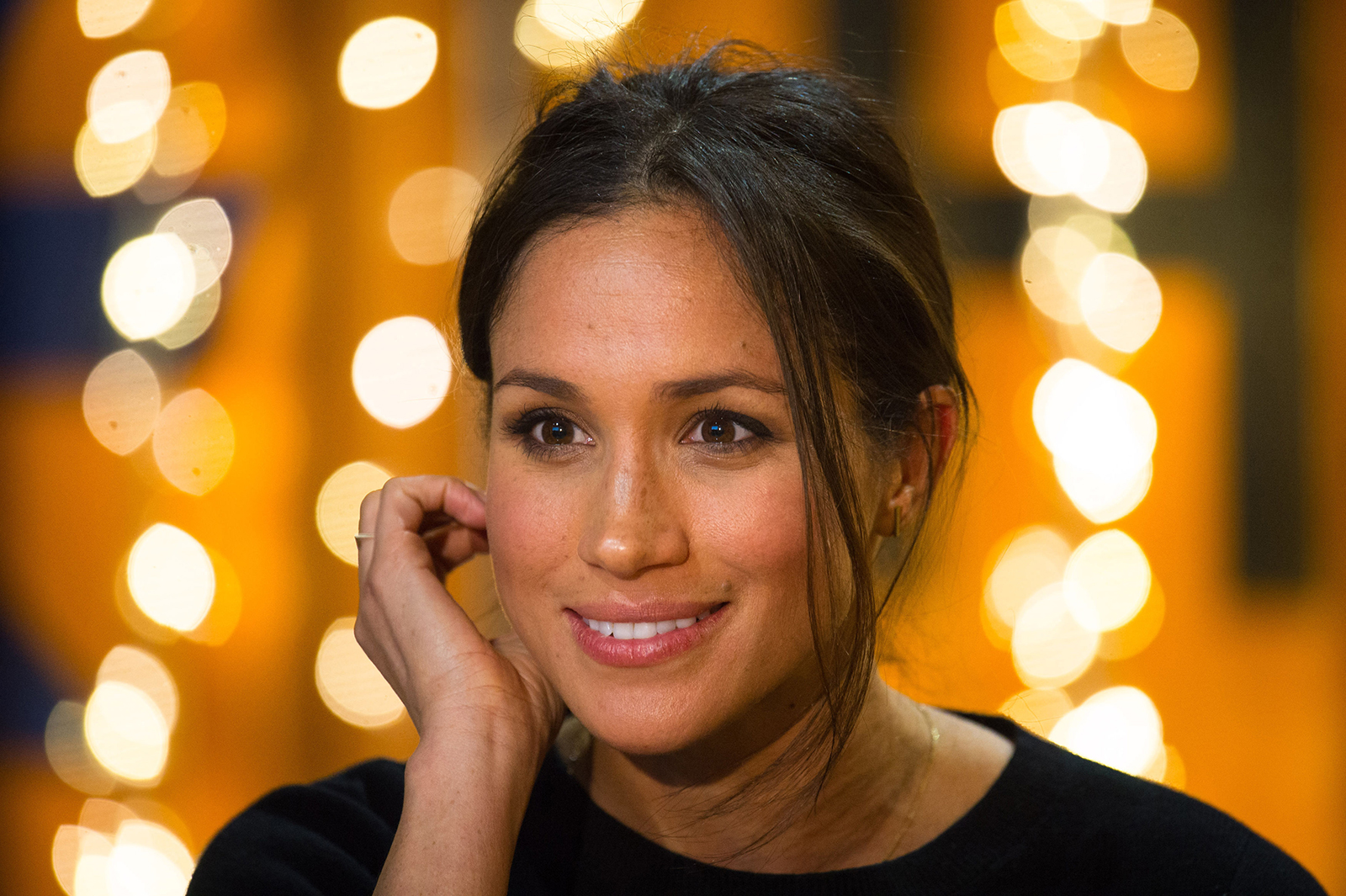 Britain's Prince Harry's fiancée Meghan Markle gestures during a visit to Reprezent 107.3FM community radio station in Brixton, south west London on January 9, 2018.