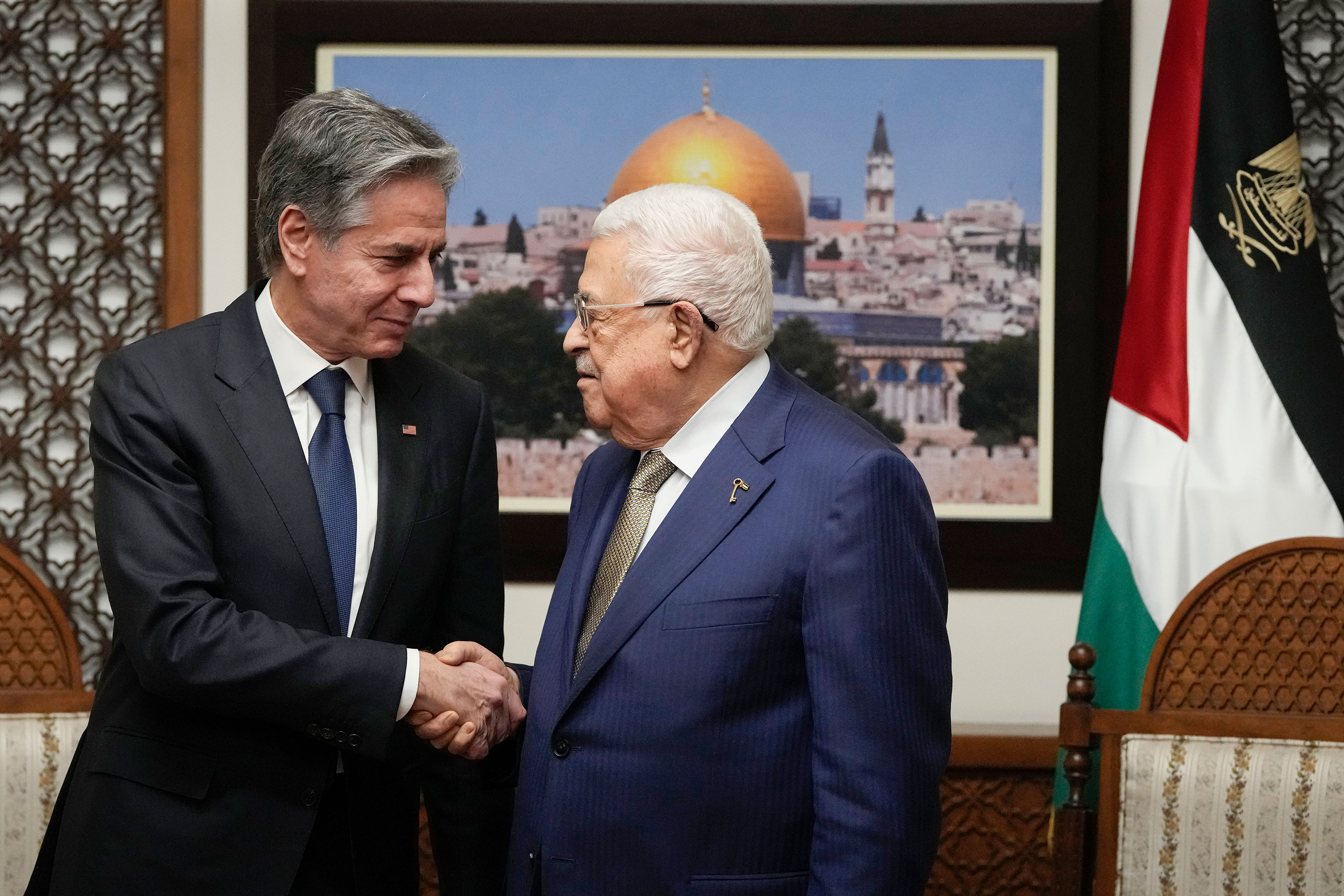 US Secretary of State Antony Blinken, left, shakes hands with Palestinian Authority President Mahmoud Abbas in the West Bank town of Ramallah on February 7. 