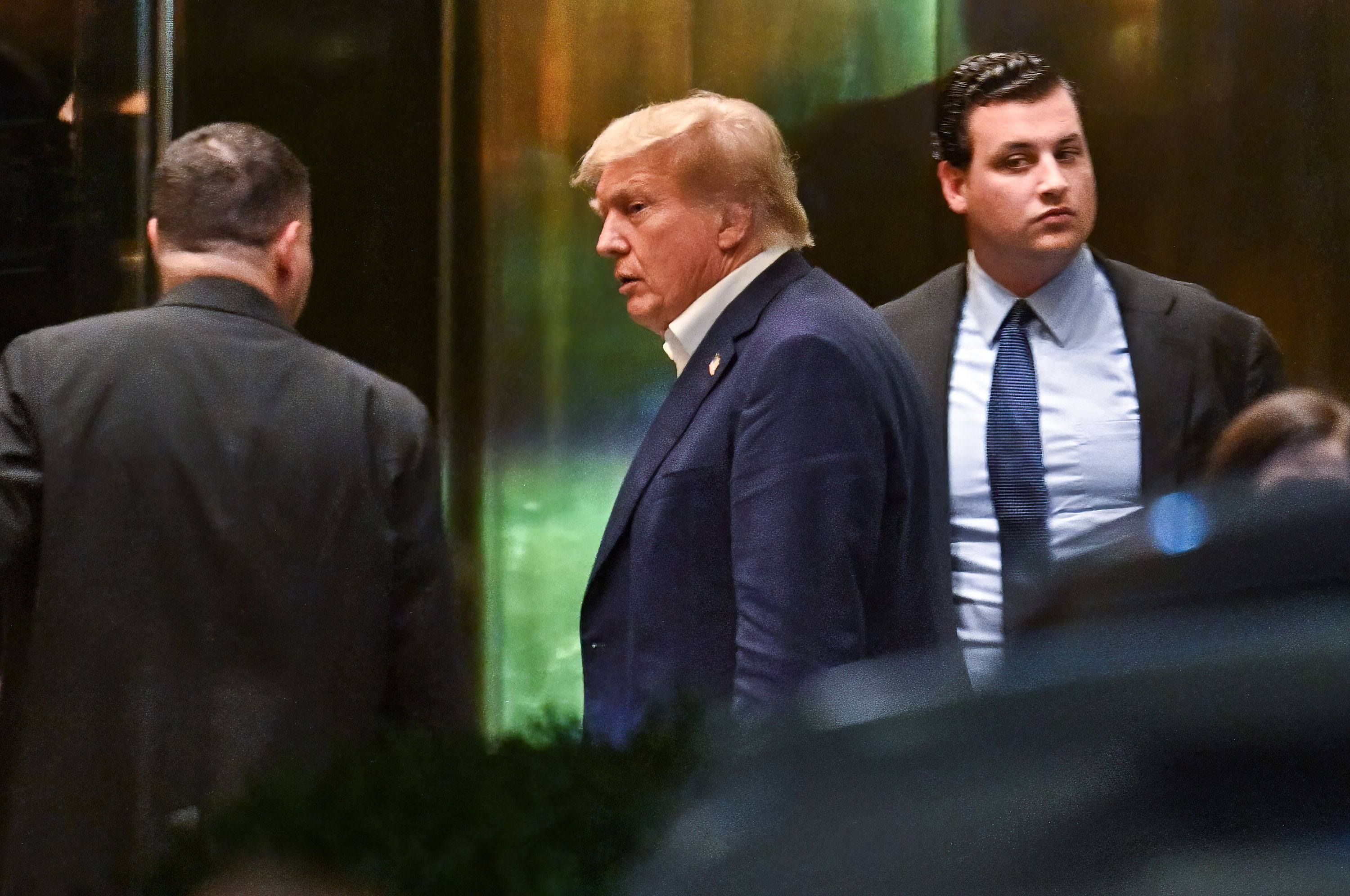 Former President Donald Trump arrives at Trump Tower in New York on Sunday evening.