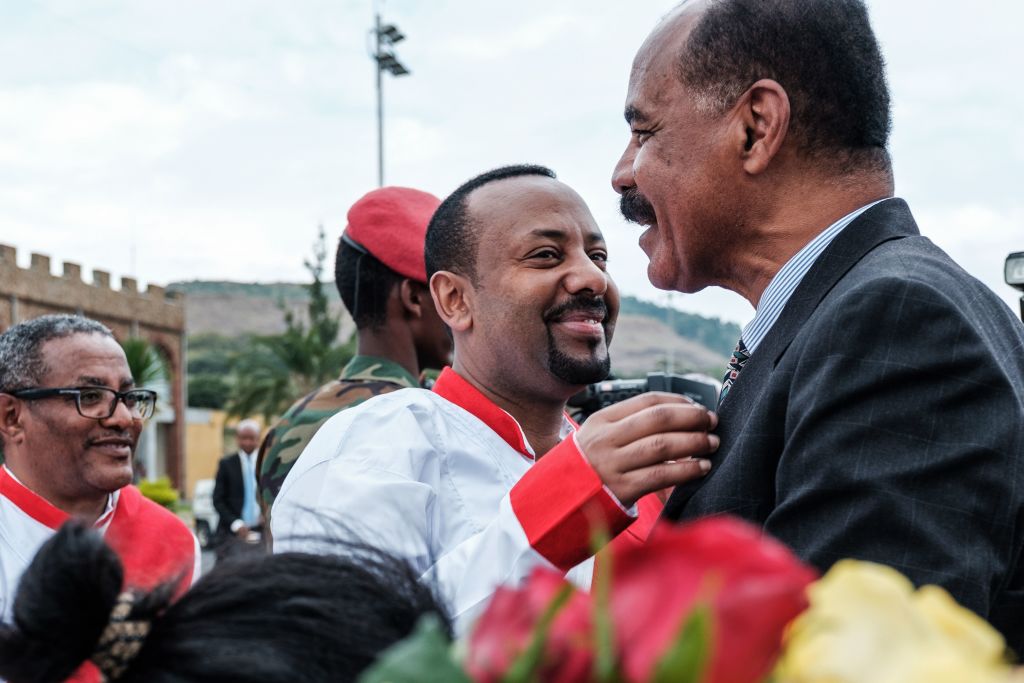 Ahmed (center) with Eritrea's President Isaias Afwerki.