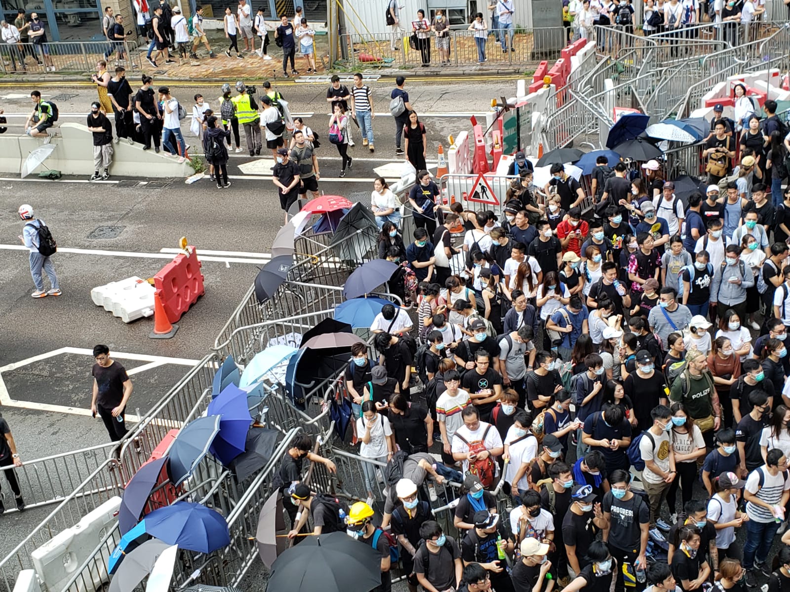 Hong Kong police call on protesters blocking roads to disperse or ...