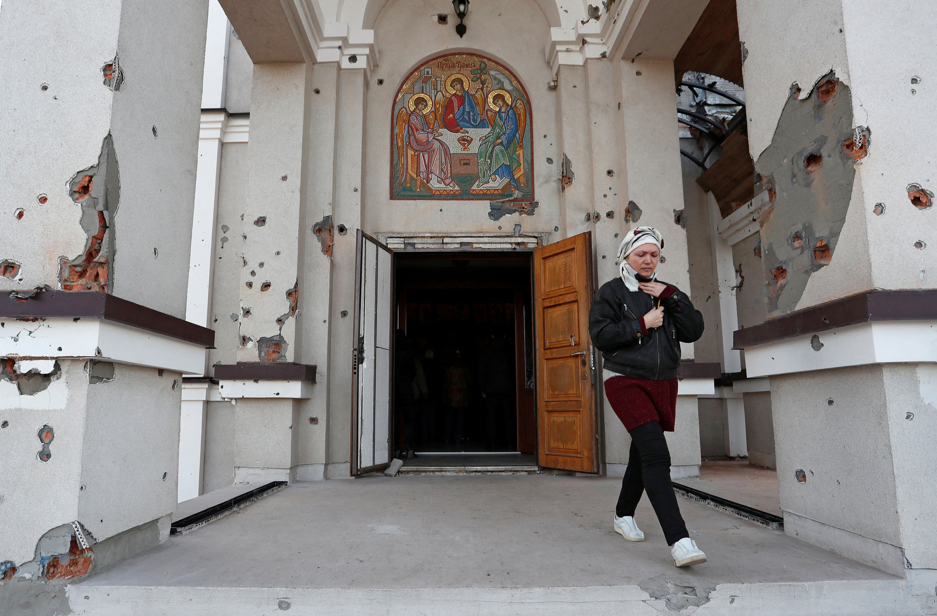 A woman walks out of the Svyato-Troitsky church during the Orthodox Easter service, amid Ukraine-Russia conflict, in Mariupol, on April 24.