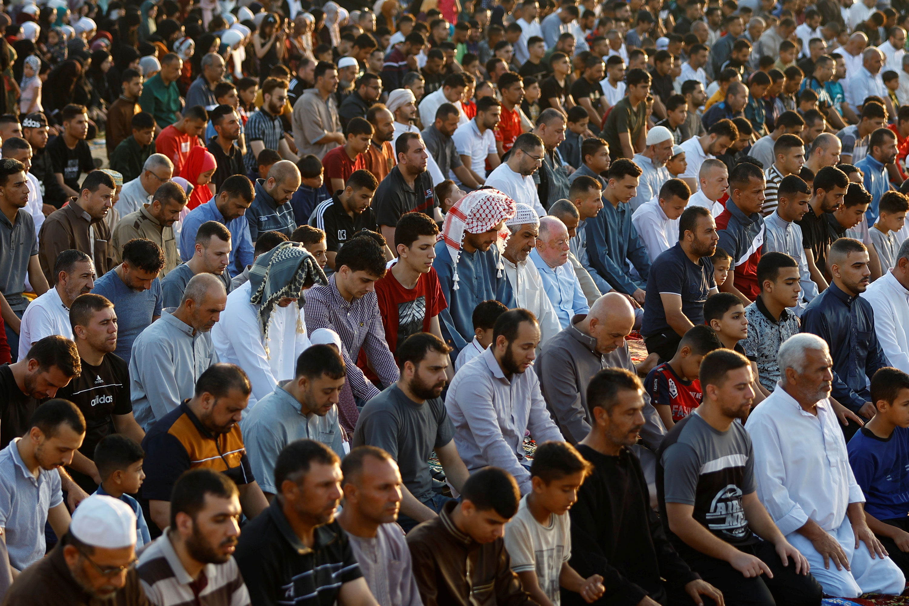 Muslims attend Eid al-Adha prayers in Khan Younis, Gaza, on June 28.