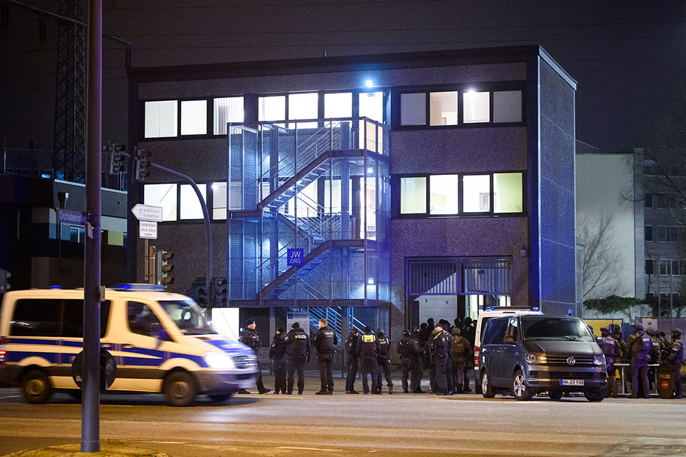 Police officers gather at the scene of a shooting in Hamburg, Germany, on March 9, 2023.