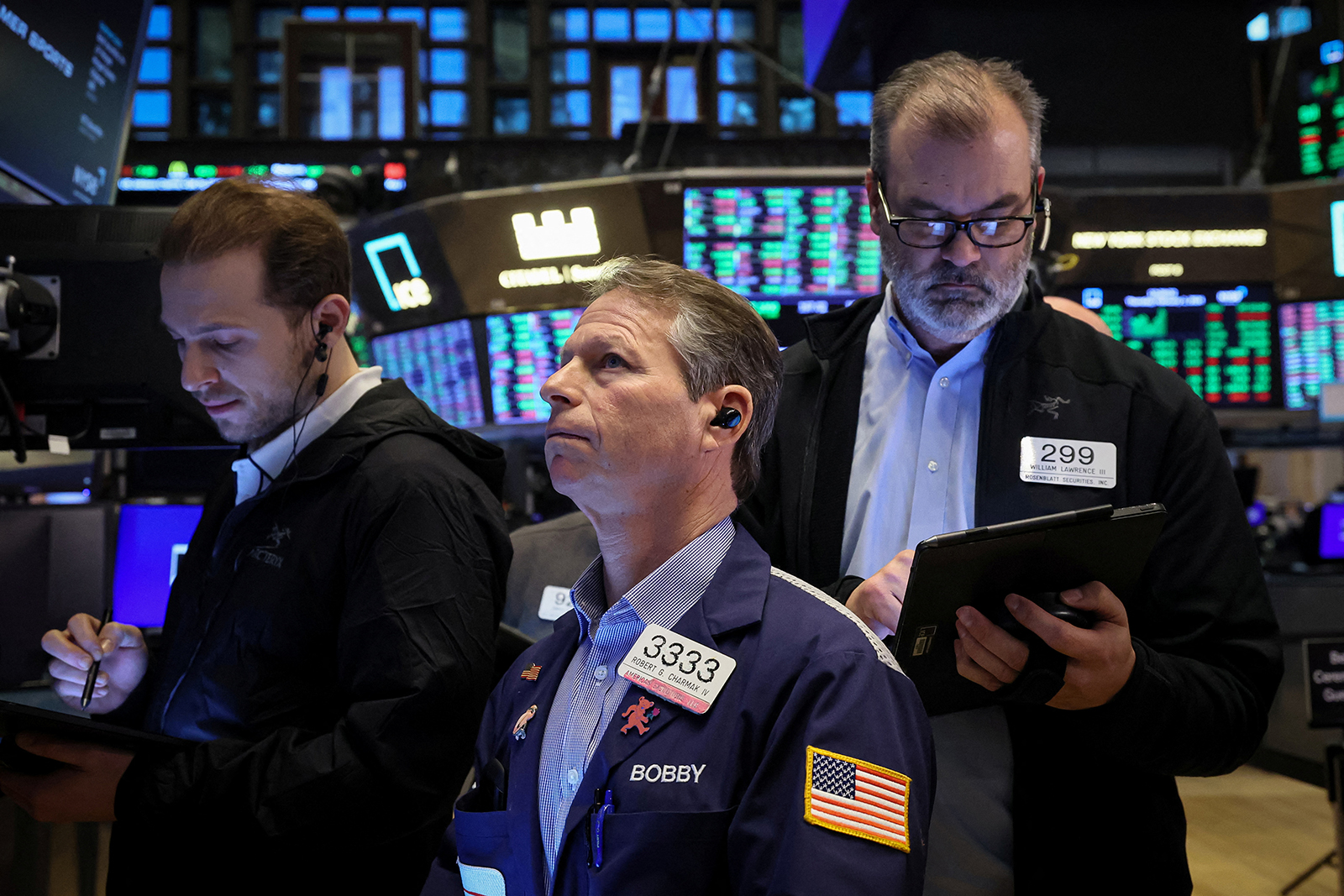 Traders work on the floor at the New York Stock Exchange on February 1.