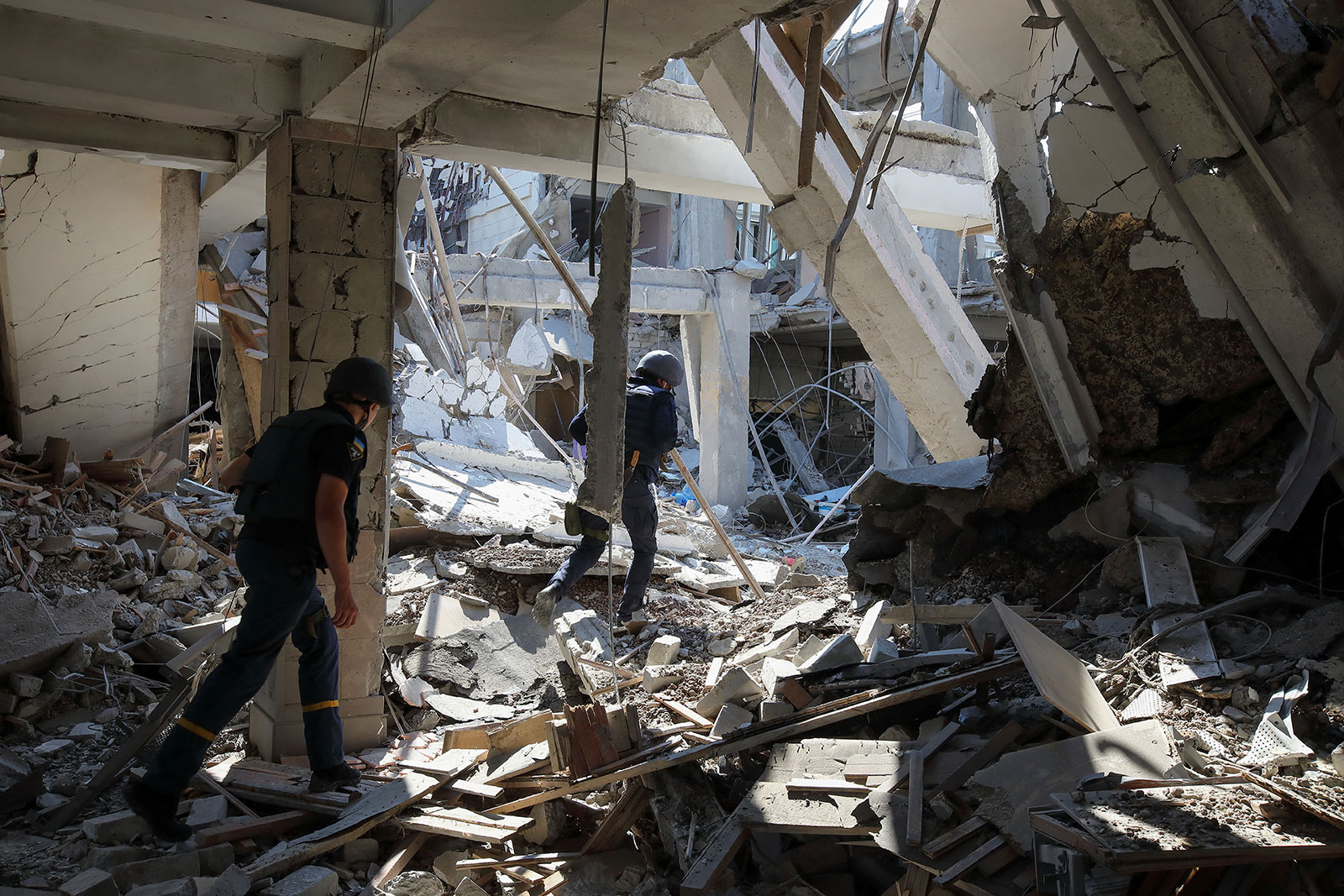 State Emergency Service workers inspect a building at H.S. Skovoroda Kharkiv National Pedagogical University damaged by a Russian missile strike on July 6.